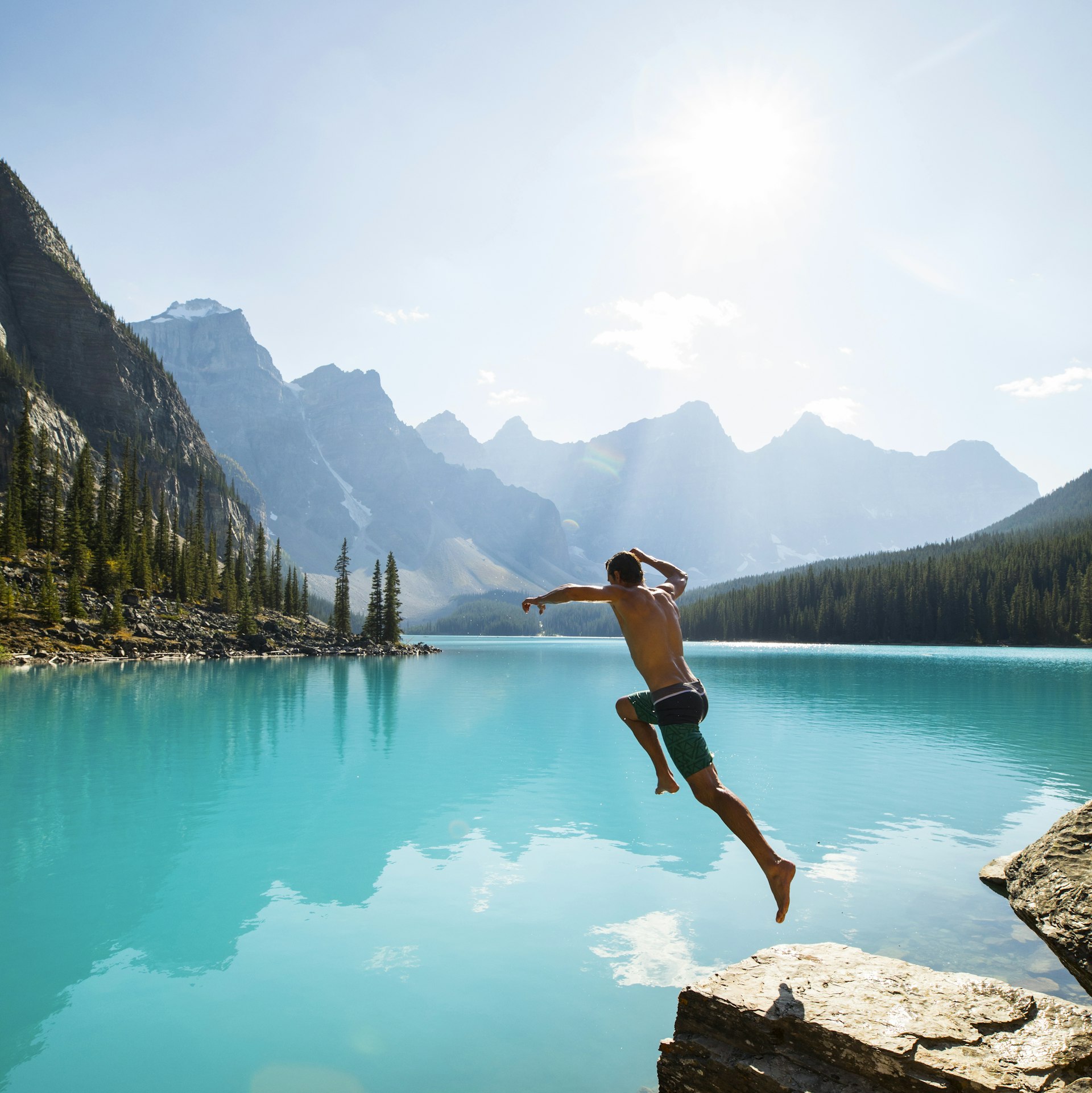 Jumping into the cool refreshing turquoise water of Lake Moraine