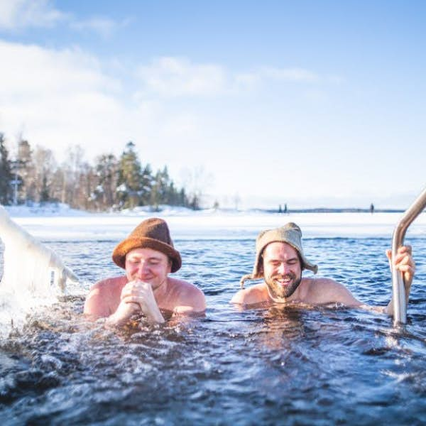 A post-sauna dip in a cold lake, Finland