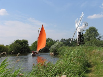 A sailboat passes a windmill near The How Hill Trust and River Ant on the Norfolk Broads, Ludlum, Norfolk.
139741846
Bush, Choice, Cloud, Direction, Dusk, Energy, England, Home Interior, Individuality, Jib, Journey, Landscape, Mast, Nature, Nautical Vessel, Norfolk, Red, Reed, Residential Structure, Ripple, Rippled, River, Sailboat, Sailing, Sea, Sky, Sport, Summer, Sunset, Tacking, Tourist, Tranquil Scene, Transportation, Travel, Urgency, Vacations, Water, Wave, Wind, Wind Power, Windmill, Yarrow, broads