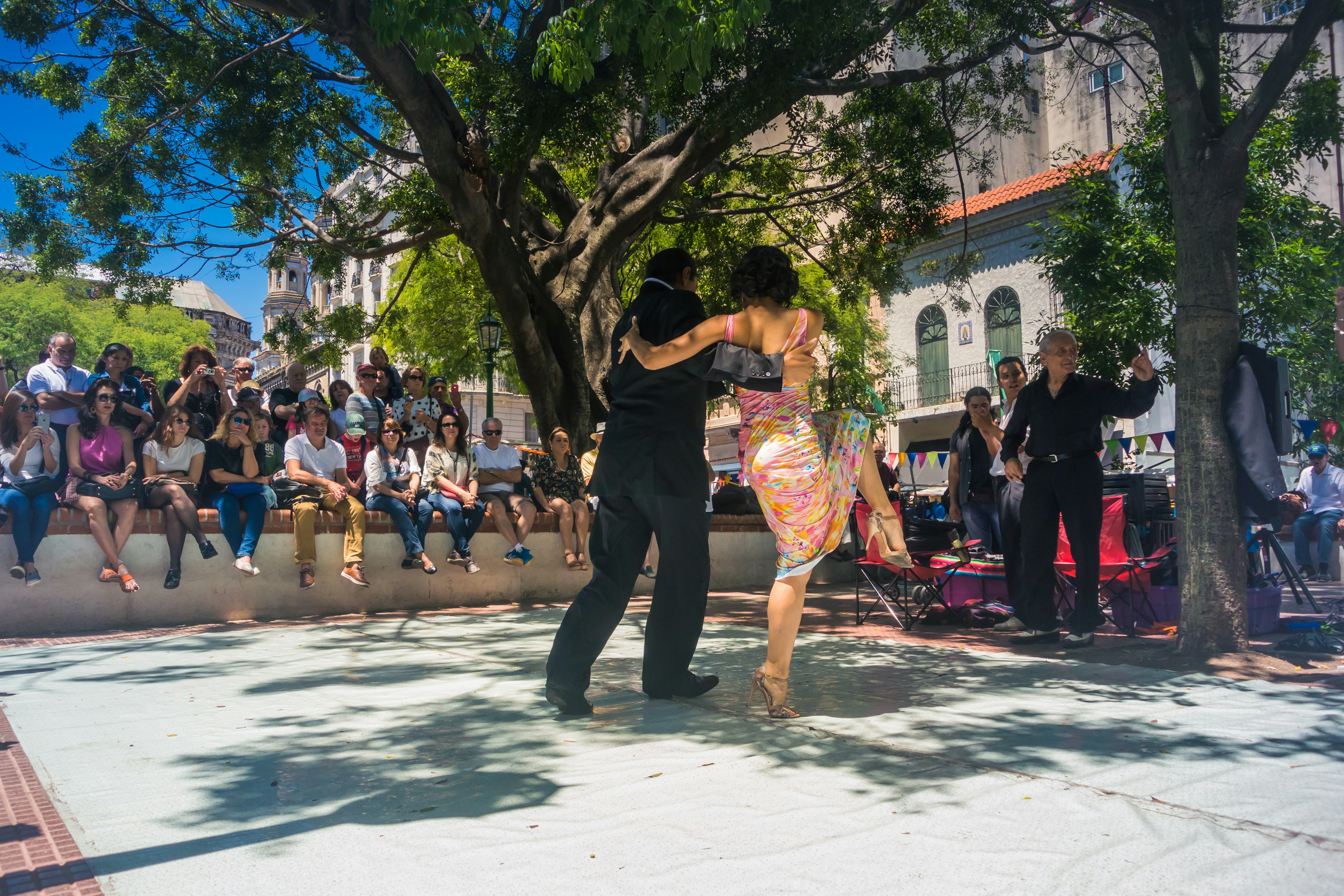 A couple dancing tango in a street performance in San Telmo neighborhood of Buenos Aires.