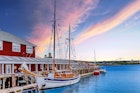HALIFAX, NOVA SCOTIA - September 16, 2014: The Halifax Harbour Walk is a boardwalk open to the public 24 hours a day, which houses shops, restaurants and tourist excursion ships, such as this sailboat; Shutterstock ID 1150728200; GL: 65050; netsuite: 65050; full: Ultimate weekend in Halifax article; name: Jennifer Carey
1150728200
The Halifax Harbour boardwalk lined with shops and bars and with a sailboat moored next to it.