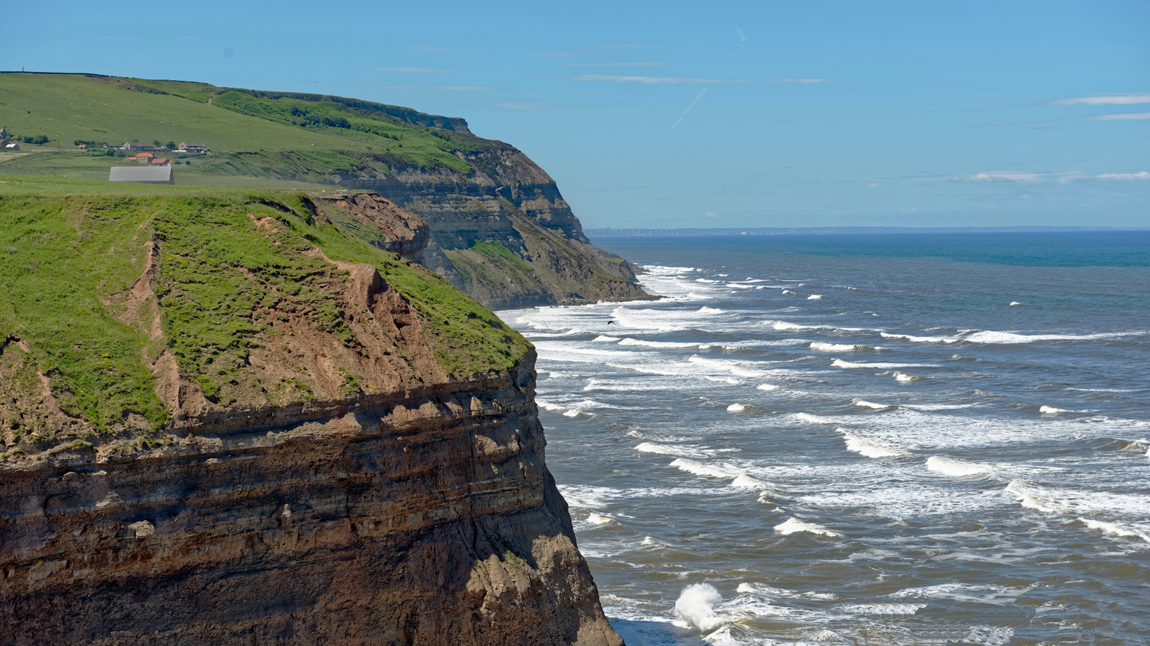 Large waves approach coastal cliffs