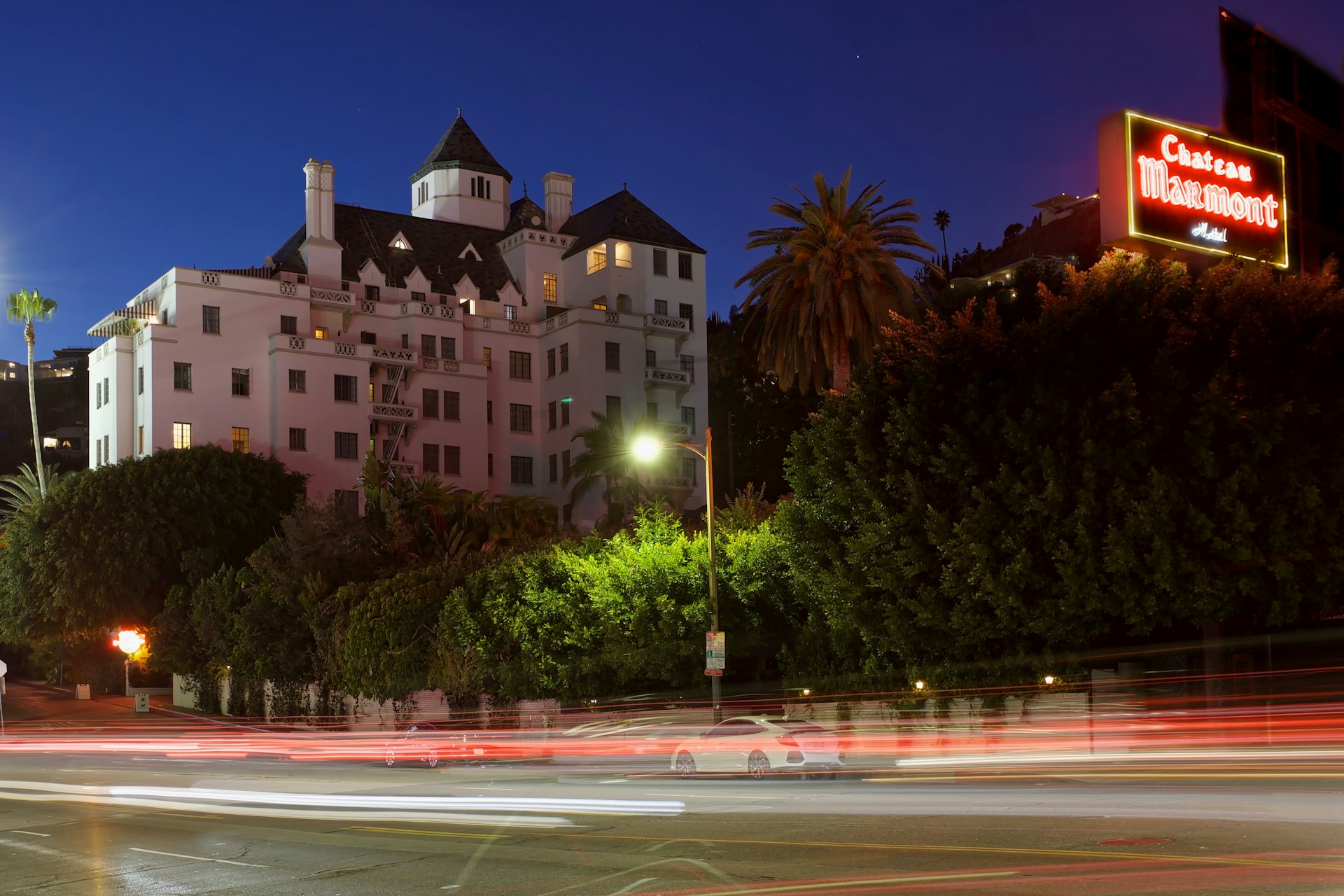 The exterior of Chateau Marmont hotel with blurred cars passing by, Los Angeles, California, USA