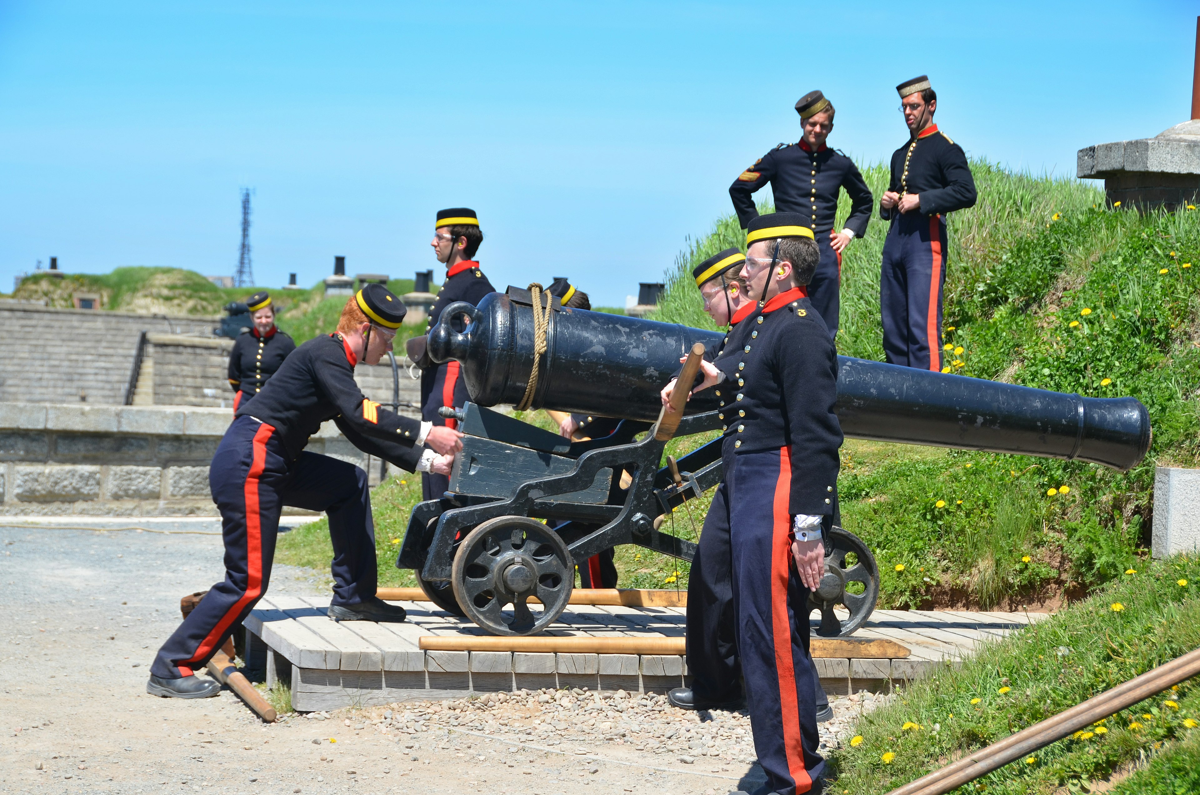 Soldiers in historic uniforms fire the daily noon cannon at Citadel Hill (Fort George), Halifax, Nova Scotia, Canada