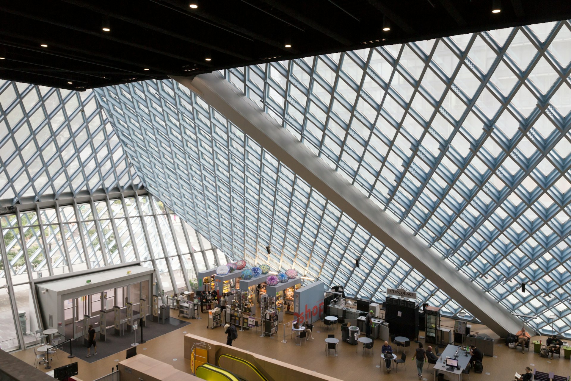 People at desks in the top-floor reading room of the Seattle Public Library, designed by Rem Koolhaas, Seattle, Washington, USA