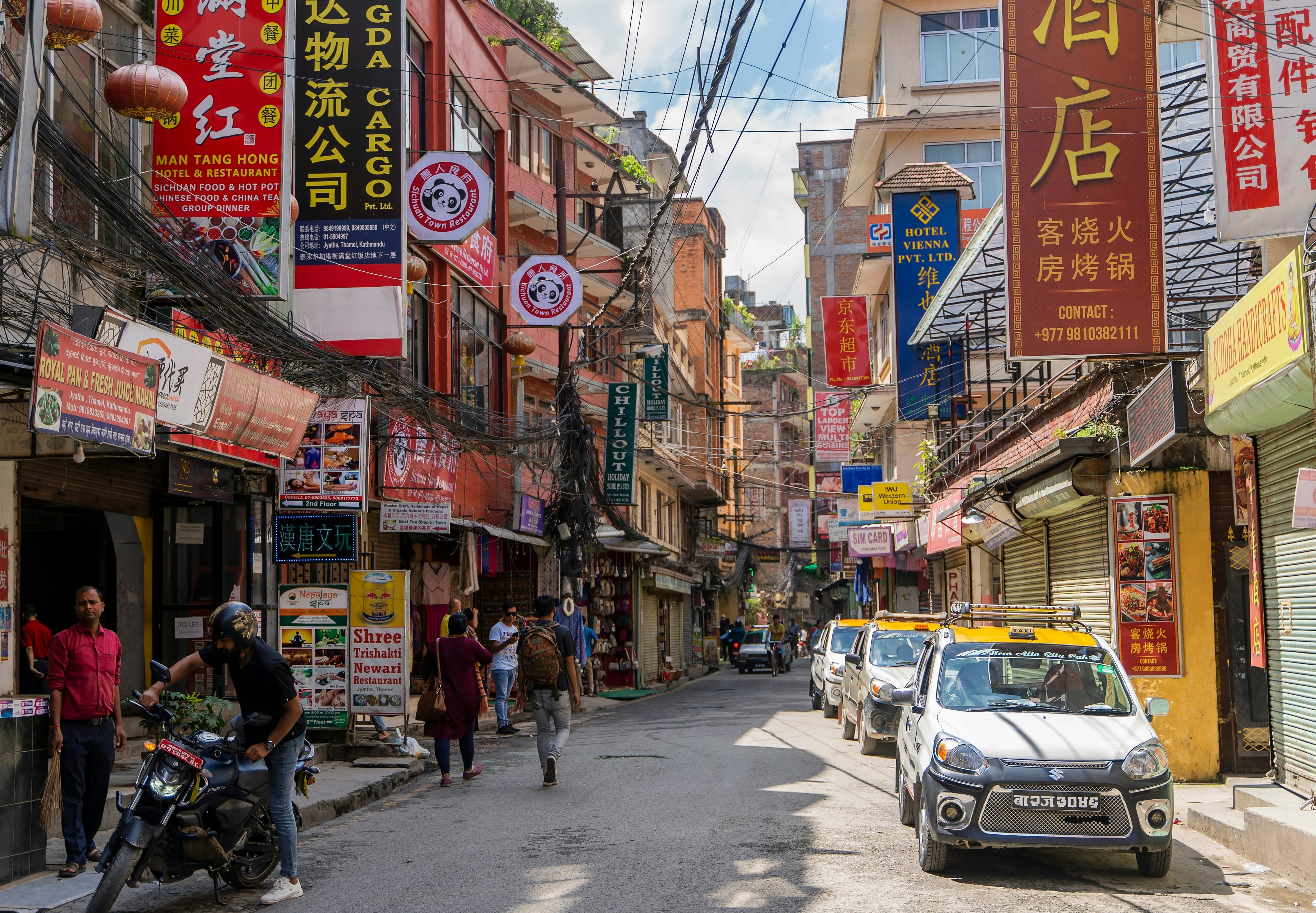 A row of taxis lined up on the street in Thamel district, Kathmandu, Nepal