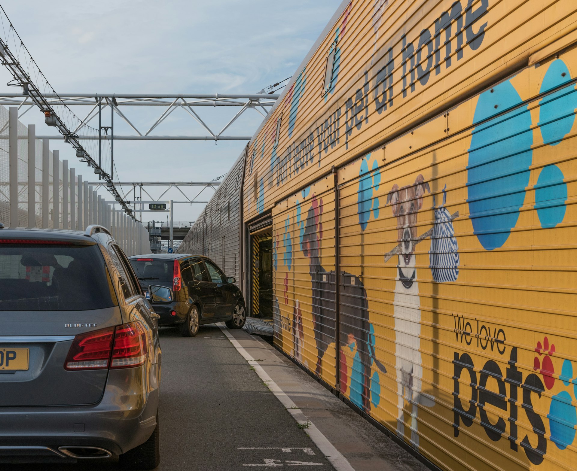 Two cars are preparing to drive onto a Eurotunnel train