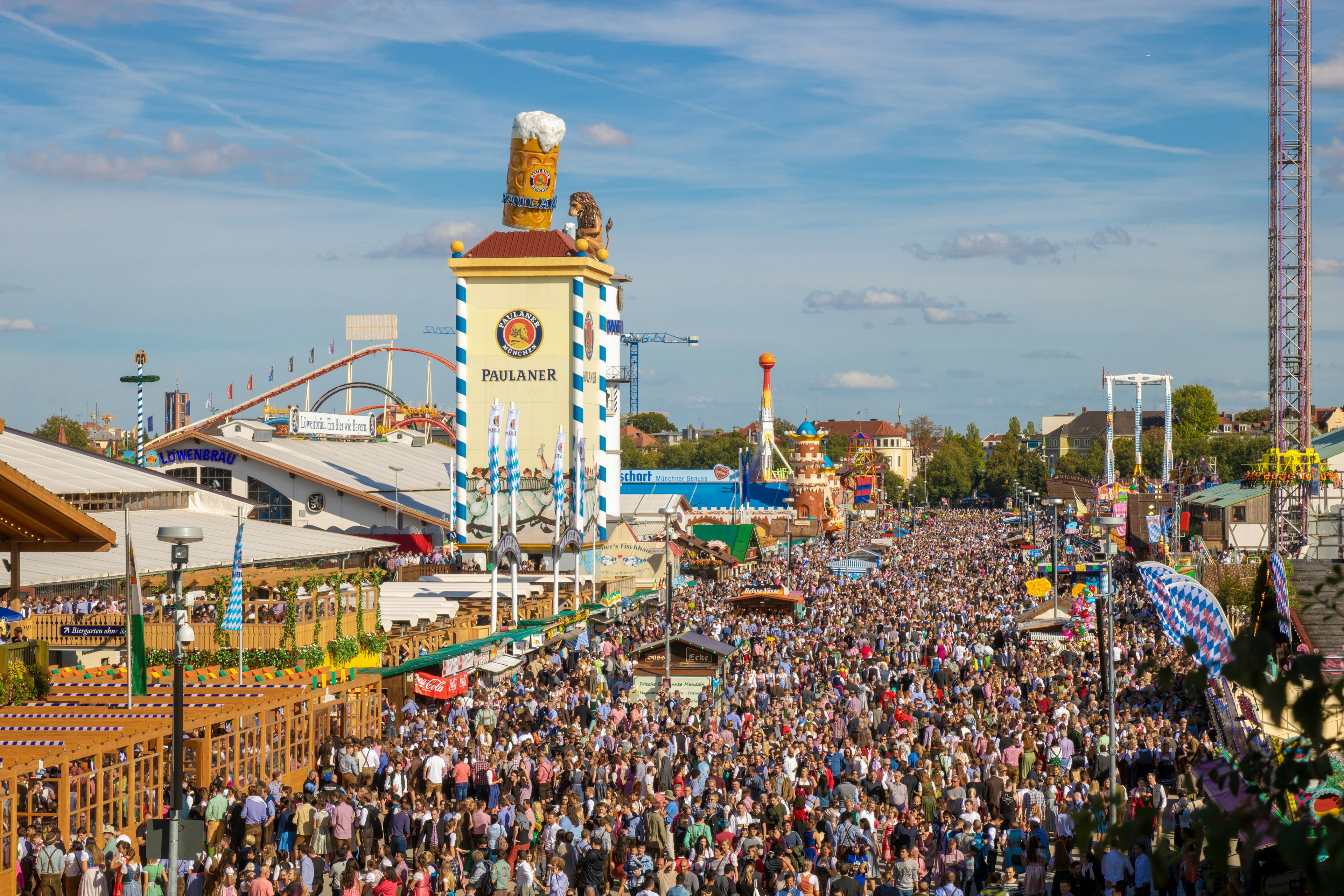 Crowds of people at a beer festival on a sunny day