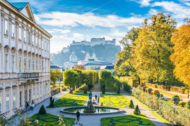 Beautiful view of famous Mirabell Gardens with the old historic Fortress Hohensalzburg in the background in Salzburg, Austria