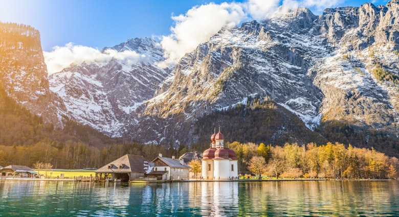 Panoramic view of scenic mountain scenery with Lake Konigssee with famous Sankt Bartholomae pilgrimage church in golden evening light in fall, national park Berchtesgadener Land, Bavaria, Germany.
alpine, alps, attraction, austria, austrian, autumn, baroque, bartholoma, bartholomae, bartholomew, bartholomew's, bavaria, bavarian, bayern, berchtesgaden, berchtesgadener, blue, cathedral, chapel, church, europe, fall, forest, german, germany, hirschau, indian, koenigssee, konigssee, lake, land, landmark, landscape, leaves, mountains, nature, panorama, pilgrimage, reflection, rocks, sankt, sky, snow, st, st., summer, sunset, tourism, tourist, travel, trees, water, watzmann, wilderness
