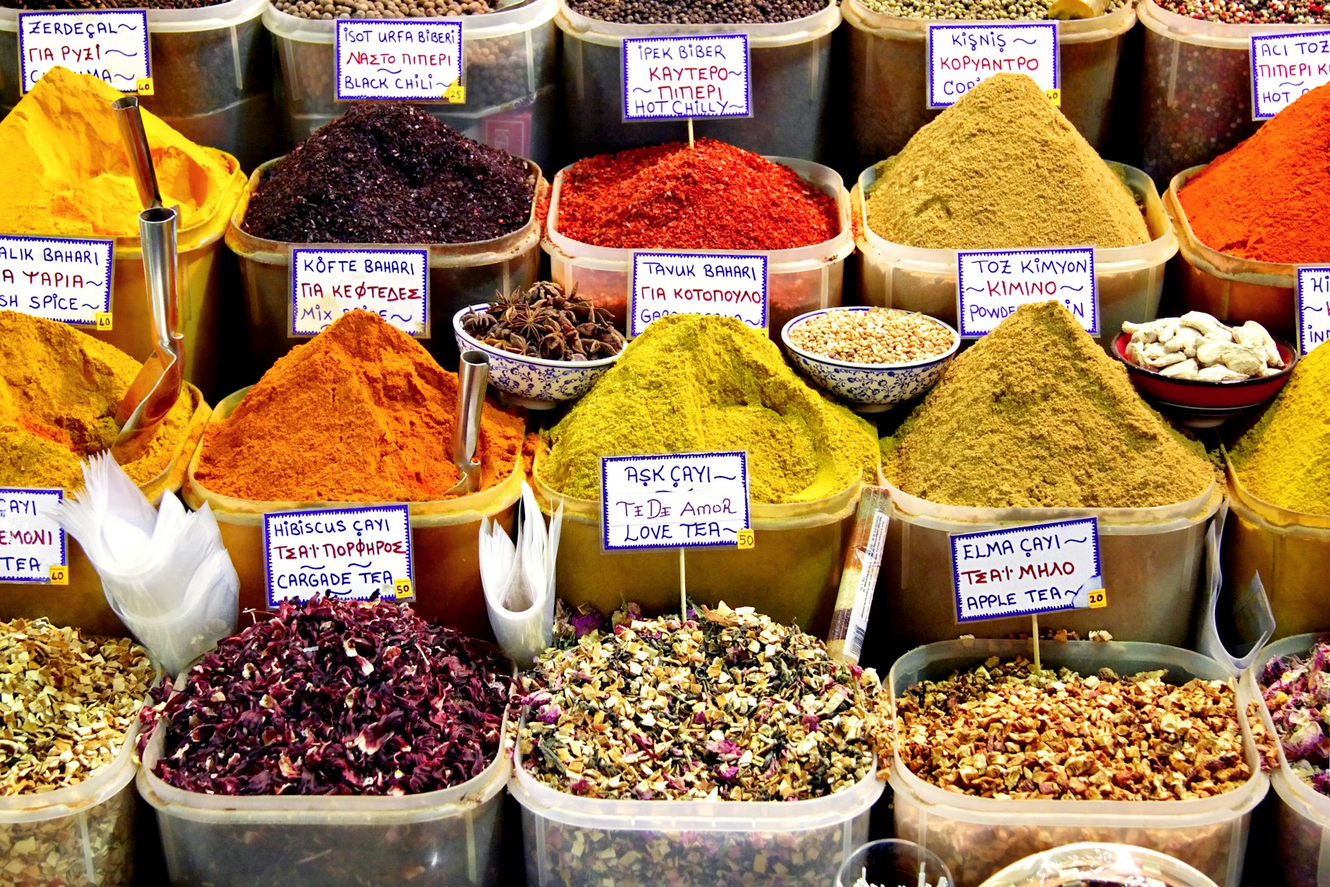 A display of containers containing many different spices in the Spice Bazaar in Istanbul