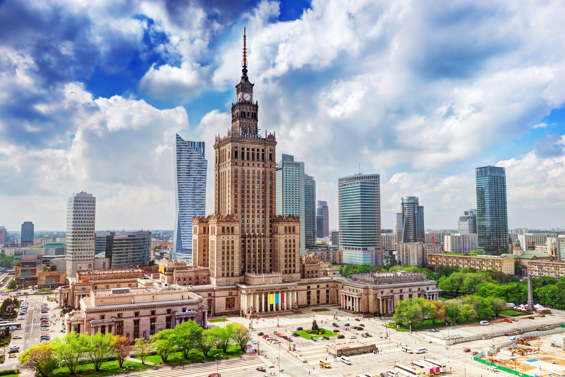 A huge ‎1950s skyscraper, the Palace of Culture & Science, is surrounded by modern skyscrapers in Warsaw.