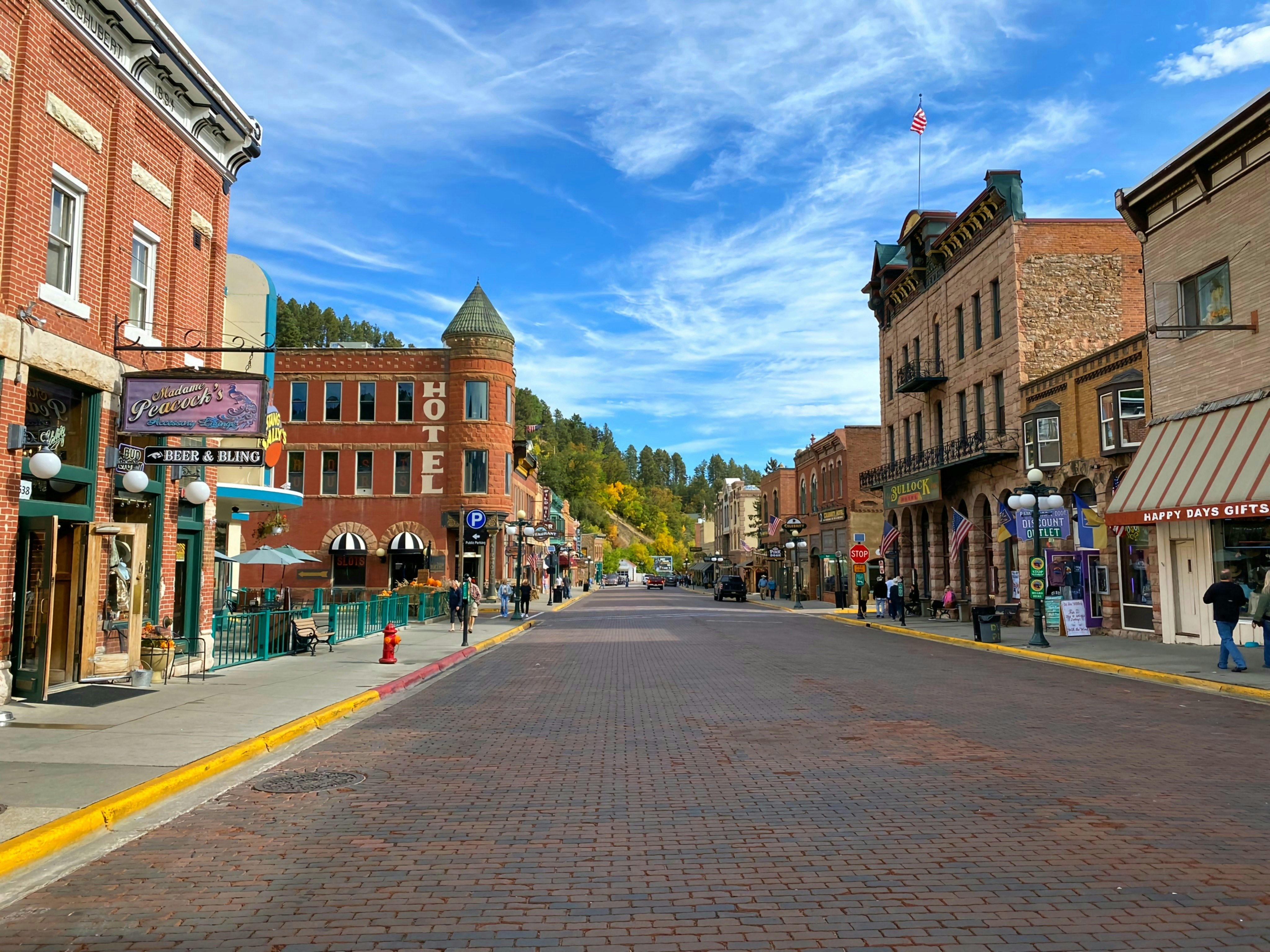 A main street lined with shops including gift shops, a saloon and a hotel