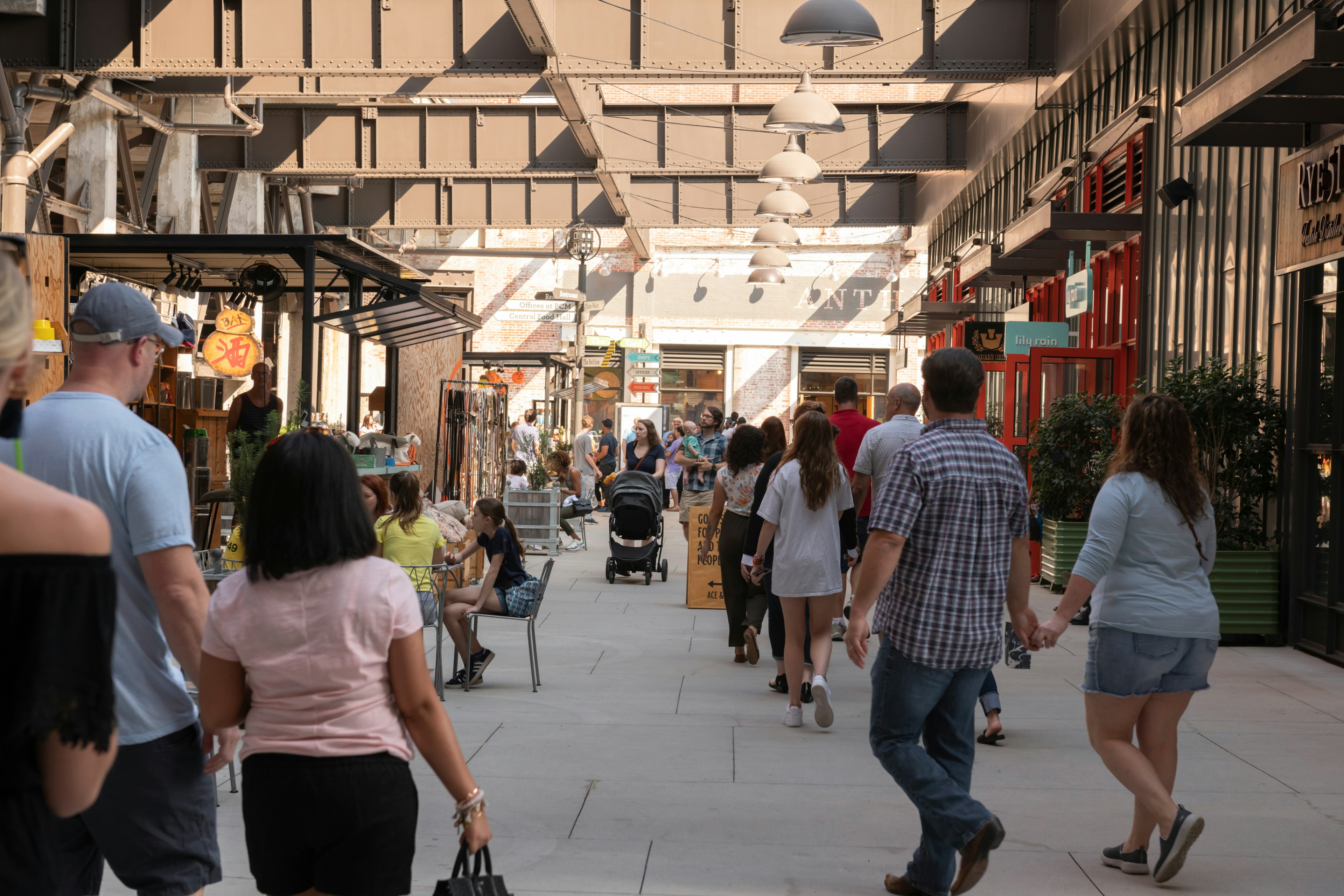 People walking past shops and restaurants at Ponce City Market