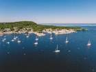 Aerial drone photography showing sailboats in the Fish Creek Harbor in Door County, Wisconsin on a summer day.
1222106361
Fish Creek Harbor in Door County Wisconsin Captured by an Aerial Drone - stock photo
Aerial drone photography showing sailboats in the Fish Creek Harbor in Door County, Wisconsin on a summer day.