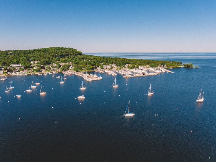 Aerial drone photography showing sailboats in the Fish Creek Harbor in Door County, Wisconsin on a summer day.
1222106361
Fish Creek Harbor in Door County Wisconsin Captured by an Aerial Drone - stock photo
Aerial drone photography showing sailboats in the Fish Creek Harbor in Door County, Wisconsin on a summer day.