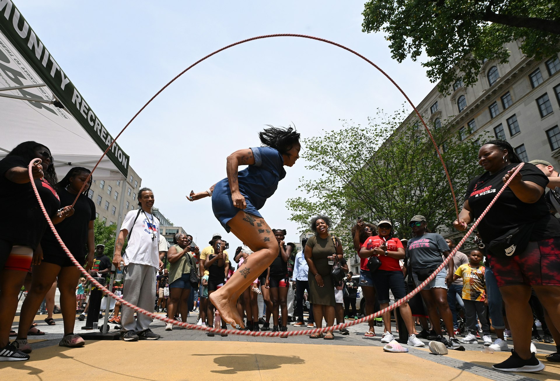 Pasua Turner jumps double dutch as people take part in a Juneteenth event along Black Lives Matter Plaza on Monday June 19, 2023 in Washington, DC.