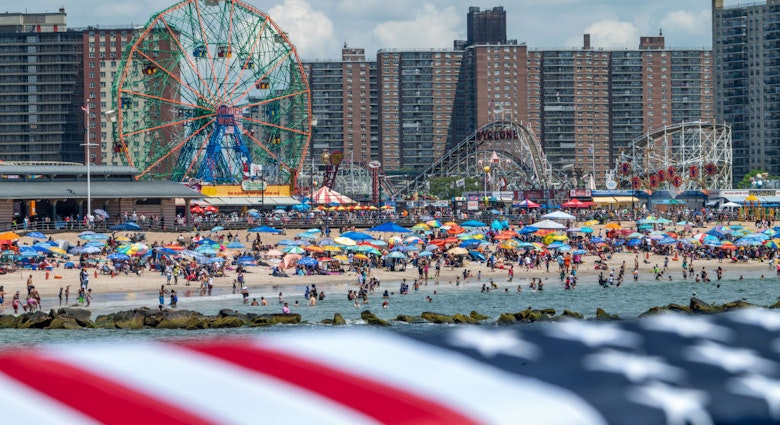 NEW YORK, NEW YORK - JULY 04: An American flag is hung as people celebrate the Fourth of July at Coney Island on July 4, 2021 in the Brooklyn borough of New York City. This year’s celebrations including, the annual Nathan’s hot dog eating contest, and the Macy’s 4th of July fireworks display, are happening at full capacity following smaller or mostly virtual celebrations in 2020 due to the coronavirus pandemic.  (Photo by Alexi Rosenfeld/Getty Images)
NEW YORK, NEW YORK - JULY 04: An American flag is hung as people celebrate the Fourth of July at Coney Island on July 4, 2021 in the Brooklyn borough of New York City. This year’s celebrations including, the annual Nathan’s hot dog eating contest, and the Macy’s 4th of July fireworks display, are happening at full capacity following smaller or mostly virtual celebrations in 2020 due to the coronavirus pandemic.  (Photo by Alexi Rosenfeld/Getty Images)
1326986618
independence day- us holidays, 4th of july, bestof, topix