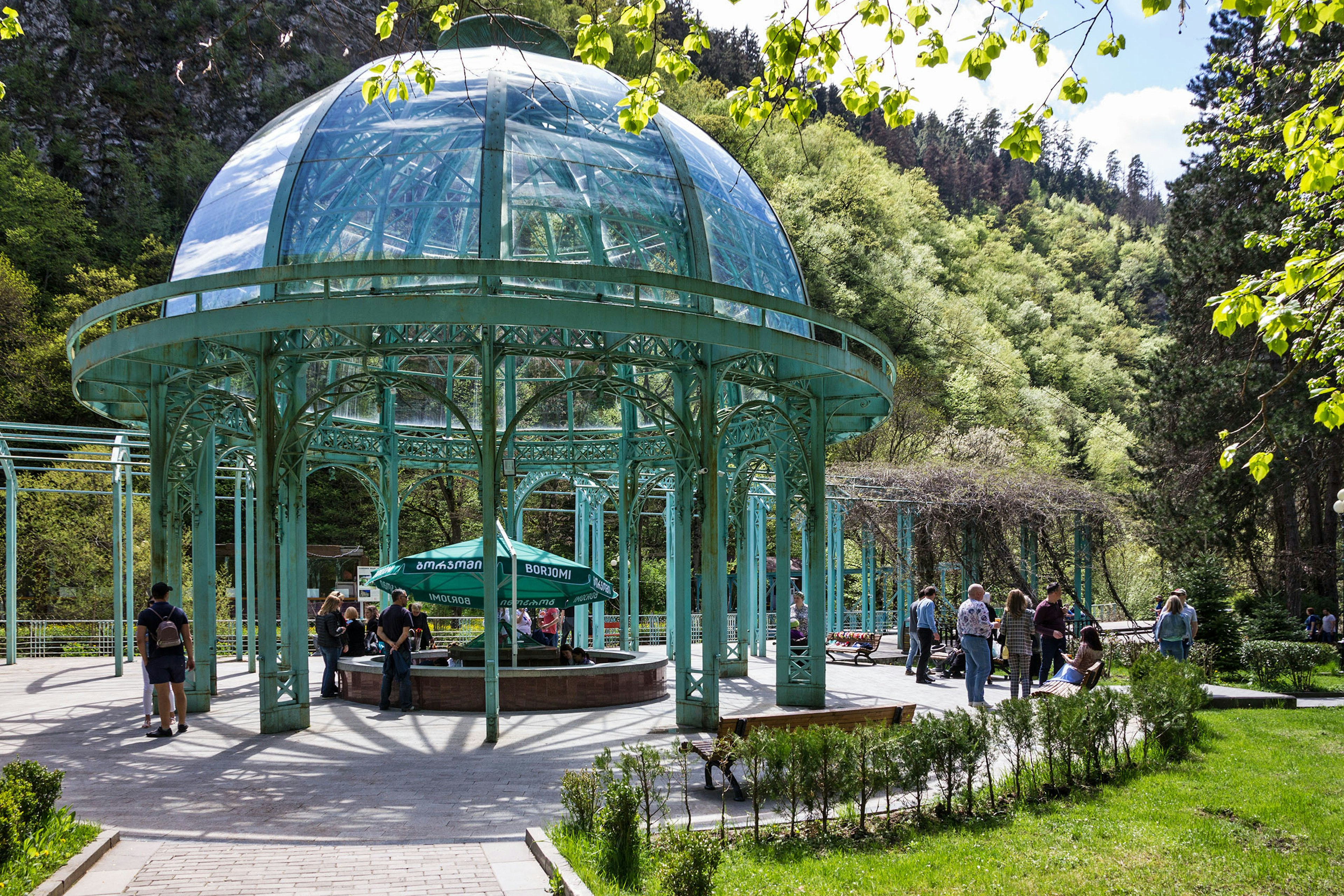 A light-blue pergola over a spring water fountain in the spa town of Borjomi