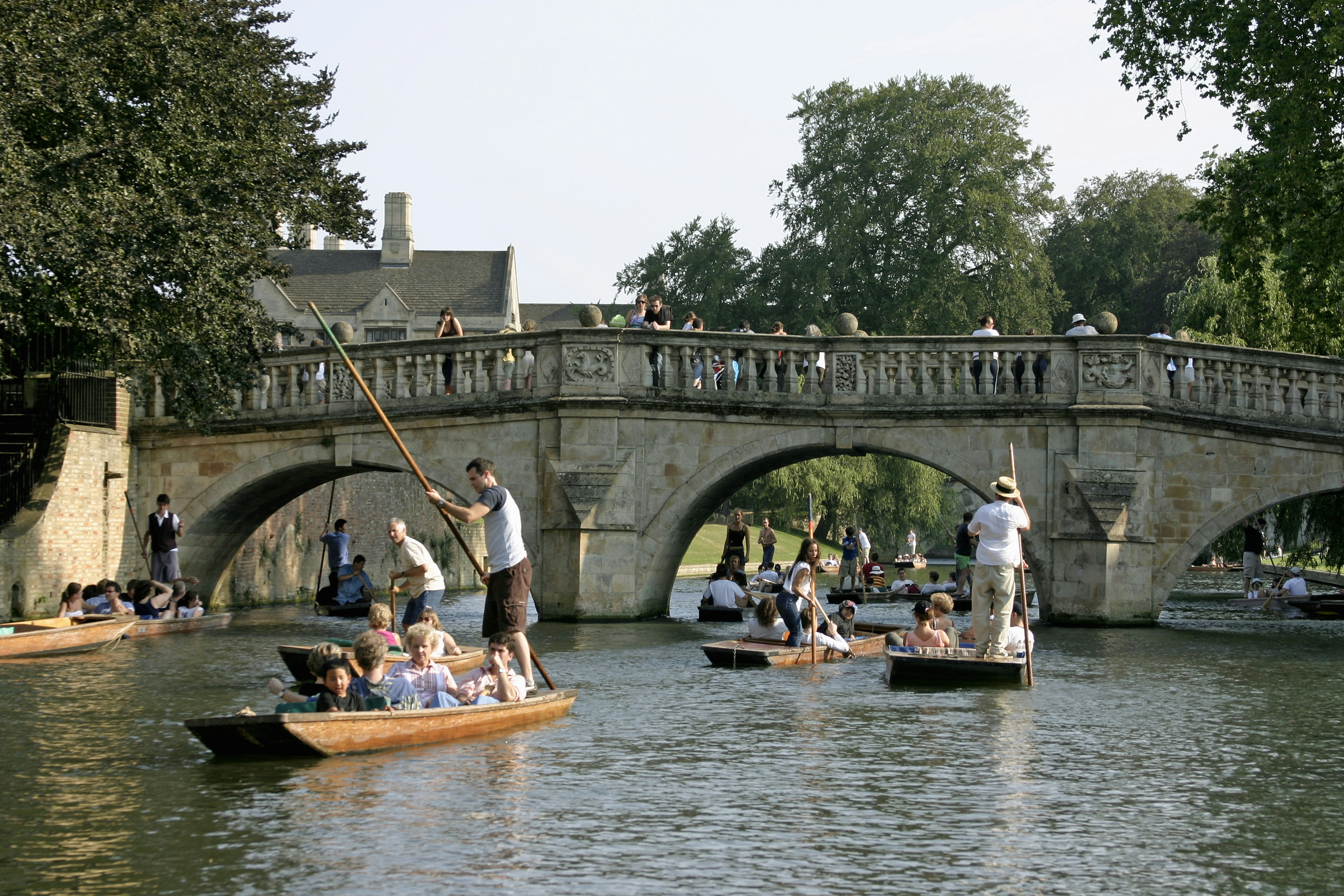 Punts and people punting on the River Cam near King's College, Cambridge, England