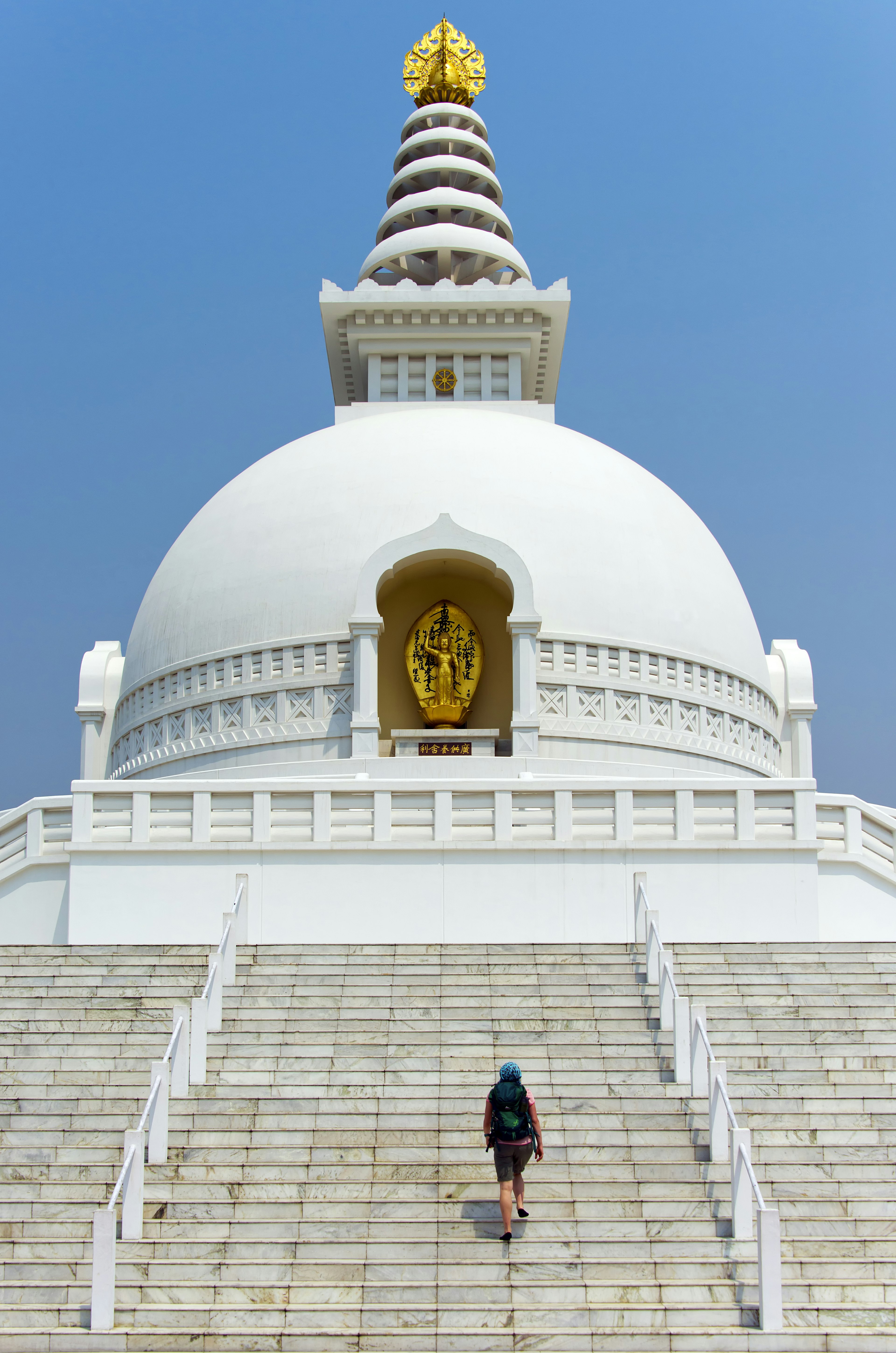 World Peace Pagoda in Lumbini with person climbing stairs