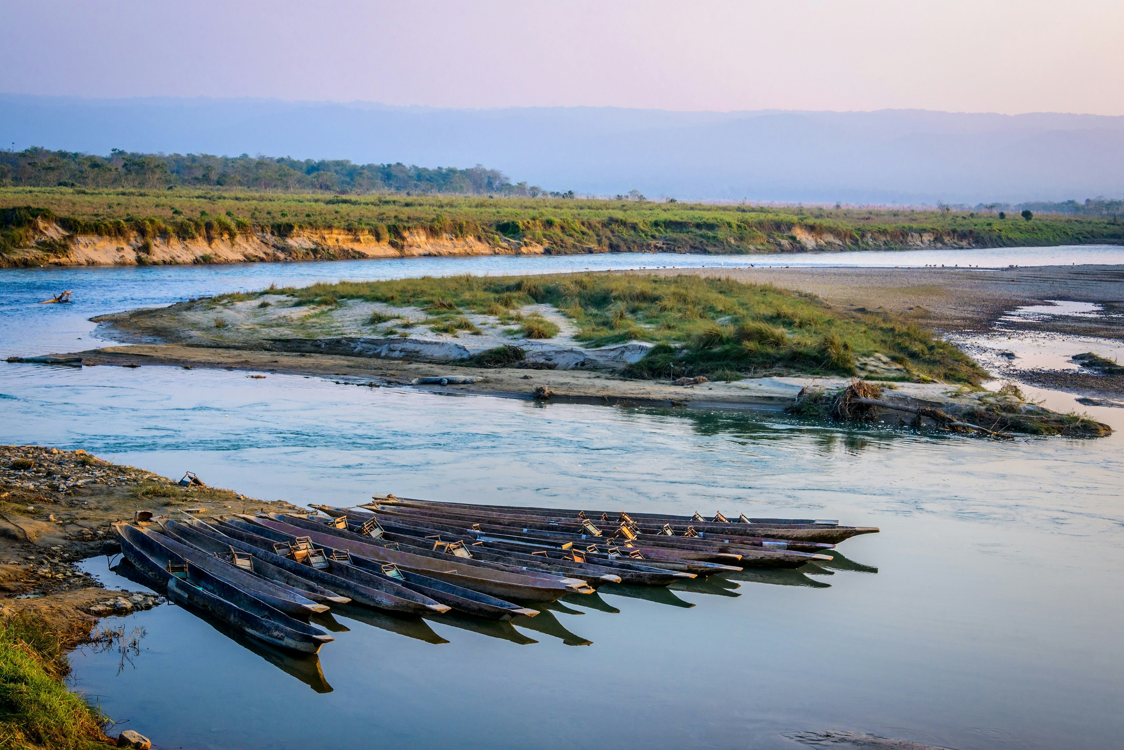 Pirogues on the Rapti river in Chitwan, Nepal