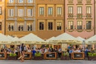 April 2019: Cafe in the Old Town of Warsaw on the banks of the Vistula river.
1152865287
Cityscape, Architecture, Center, Cafe, Looking At View, Downtown District, Square - Composition, Bar - Drink Establishment, Day, Town, Europa, local, Old Town, Small Group Of People, Old Market, Summer, People, Poland, Tourist, Warsaw, Tourism, Bar, Old, Business, Cultures, Lifestyles, Famous Place, Coffee, Non-Urban Scene, Capital Cities, Store, Travel, City, Europe, Outdoors, Tradition, Street, Restaurant, Photography, Horizontal