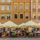 April 2019: Cafe in the Old Town of Warsaw on the banks of the Vistula river.
1152865287
Cityscape, Architecture, Center, Cafe, Looking At View, Downtown District, Square - Composition, Bar - Drink Establishment, Day, Town, Europa, local, Old Town, Small Group Of People, Old Market, Summer, People, Poland, Tourist, Warsaw, Tourism, Bar, Old, Business, Cultures, Lifestyles, Famous Place, Coffee, Non-Urban Scene, Capital Cities, Store, Travel, City, Europe, Outdoors, Tradition, Street, Restaurant, Photography, Horizontal