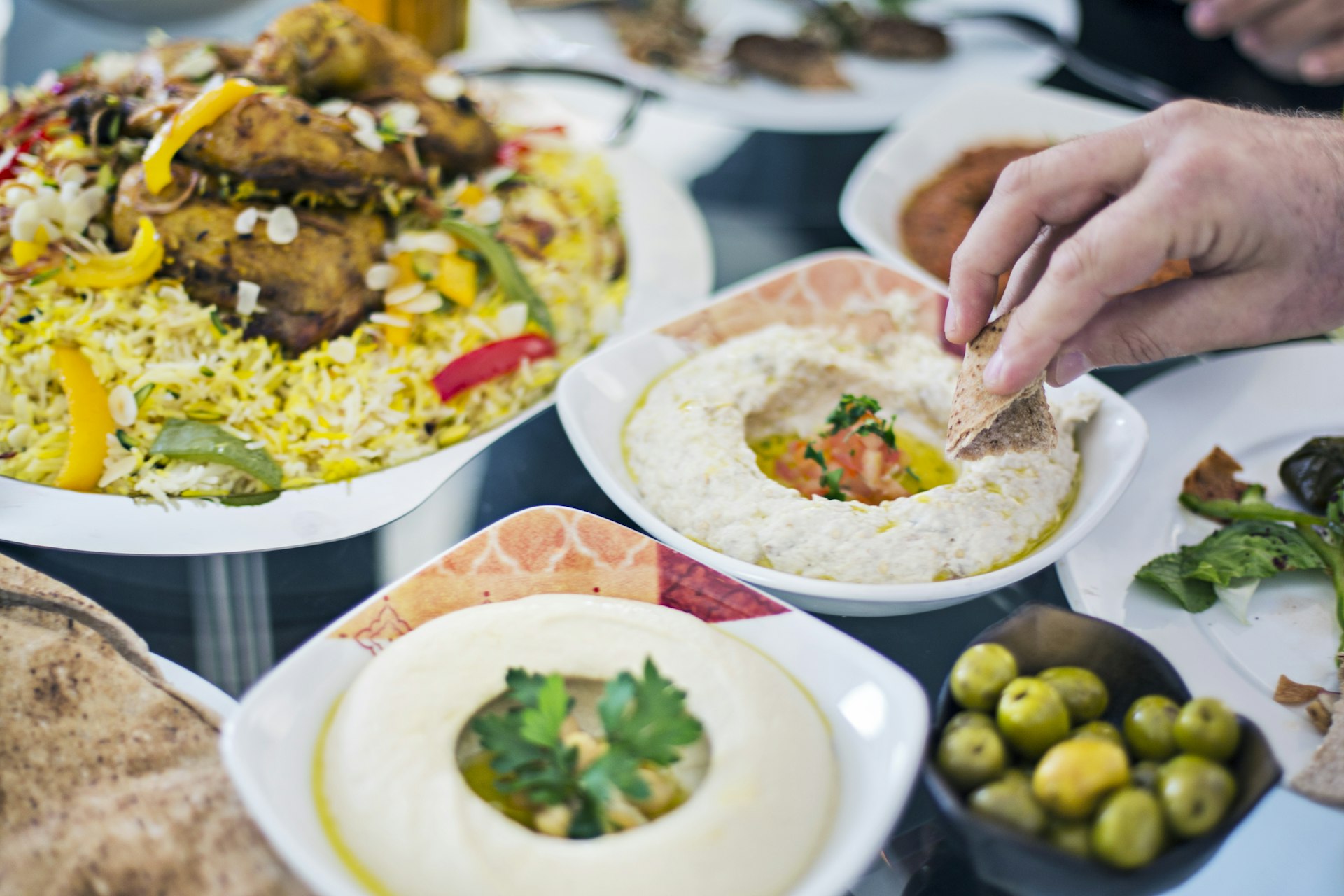 Dinning table filled with different mezze in Dubai