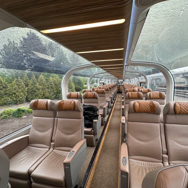 Train seats with glass windows.