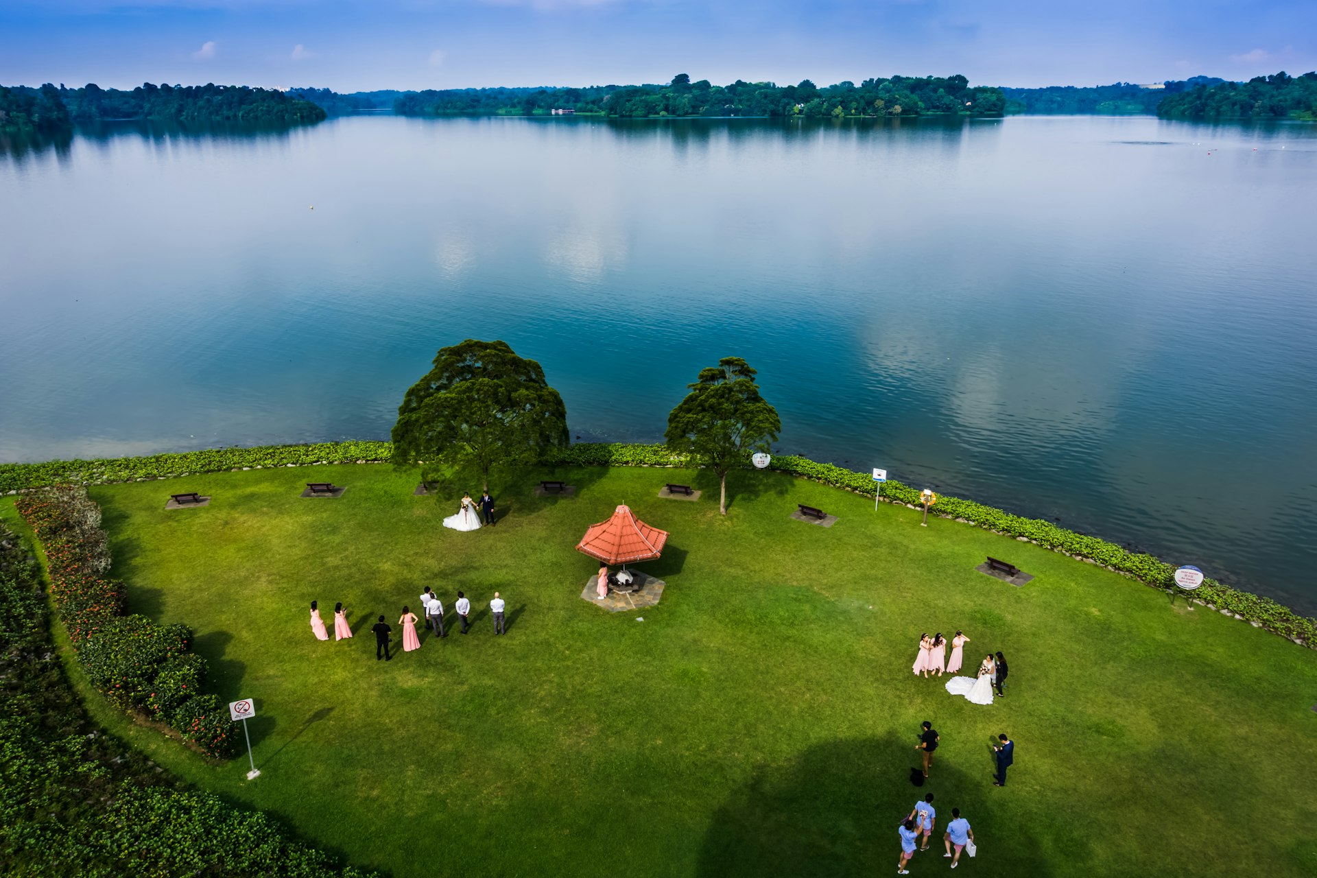 An aerial view of Upper Seletar Reservoir Park with people on the lawn 