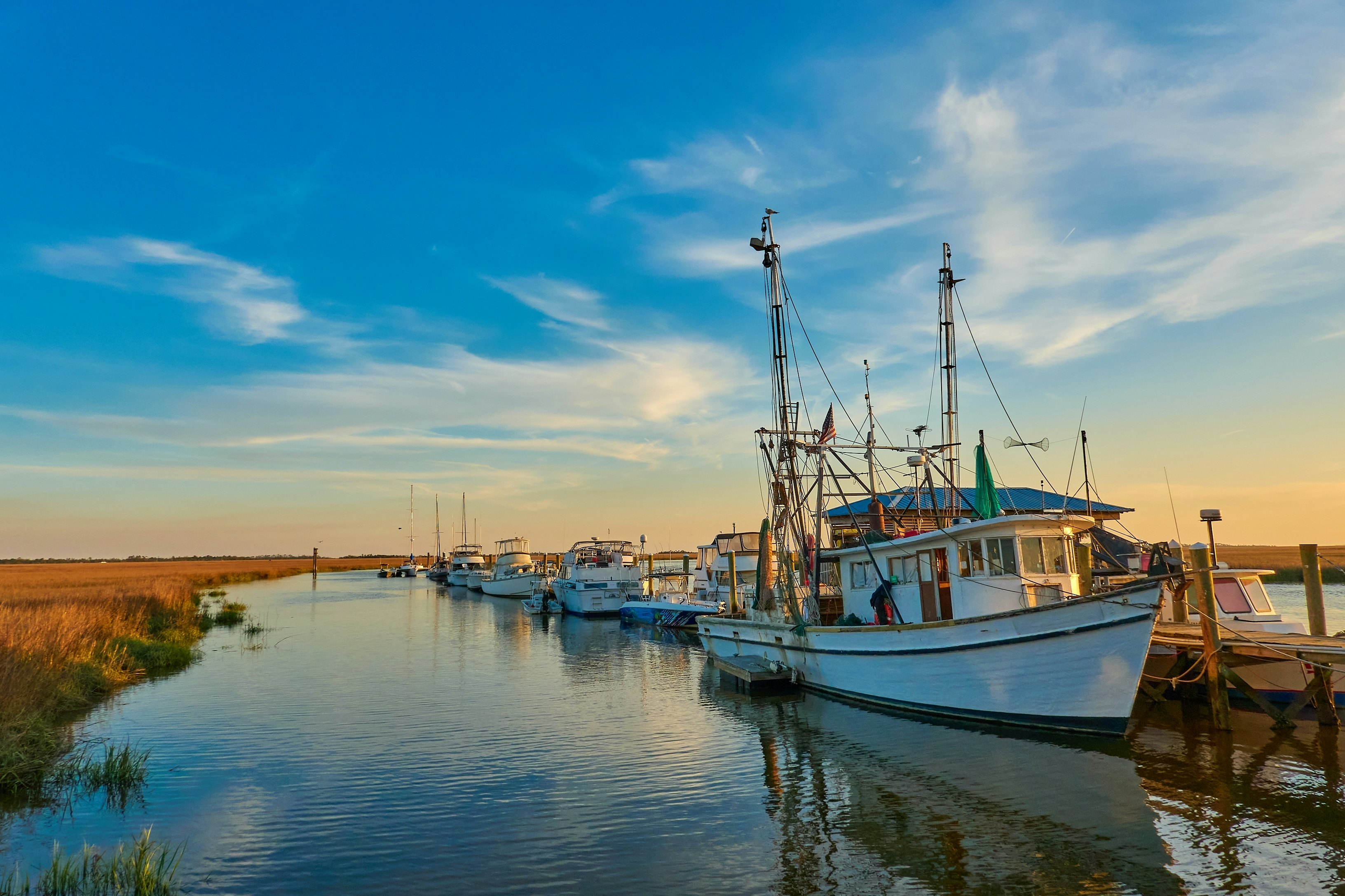 Sunset with shrimp boats along a dock at Tybee Island.