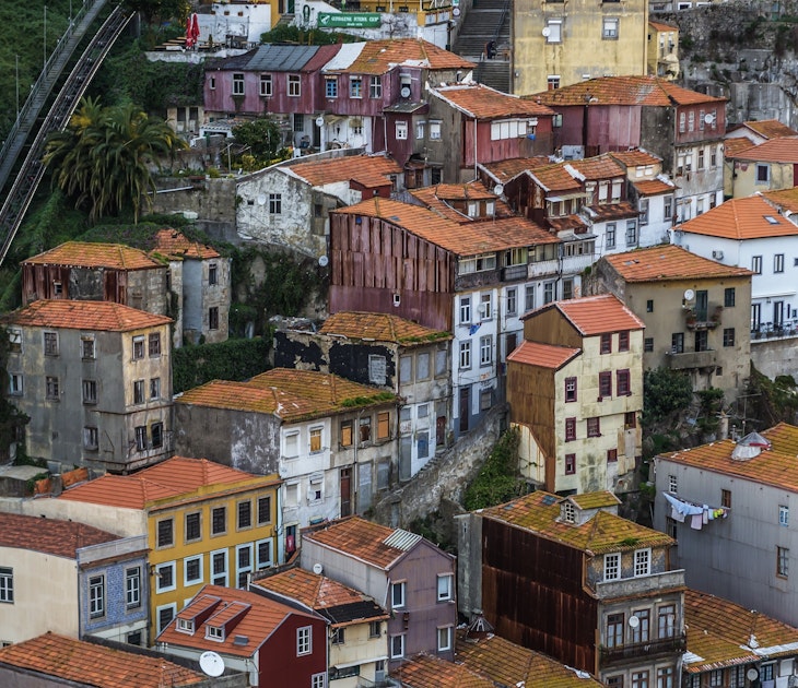View from Dom Luis I Bridge on the old part of Porto city, including of the Funicular dos Guindais ascending the hill