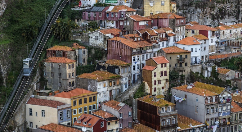 View from Dom Luis I Bridge on the old part of Porto city, including of the Funicular dos Guindais ascending the hill
