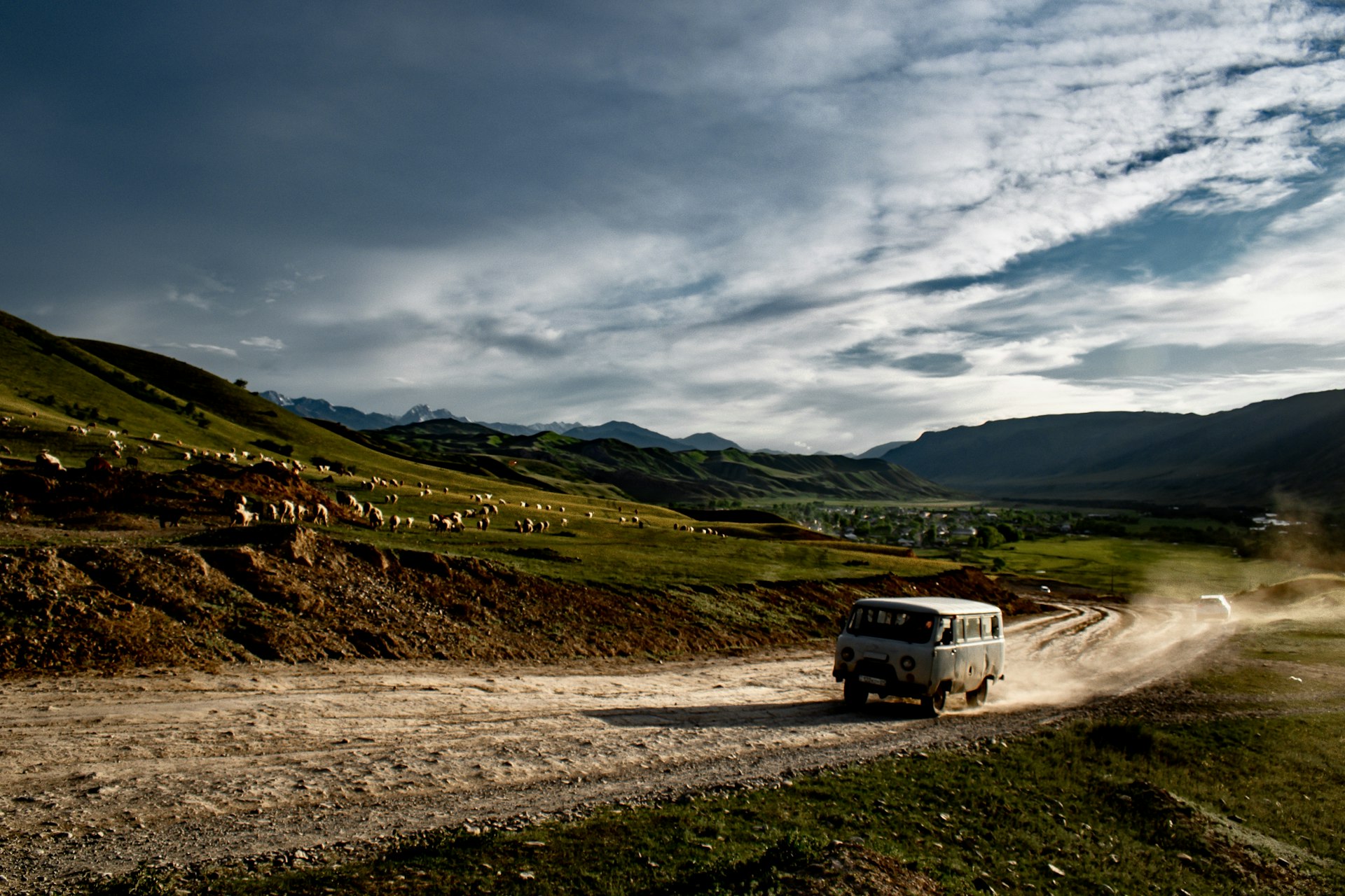 A marshrutka on the dusty road to Kaindy Lake, Kazakhstan