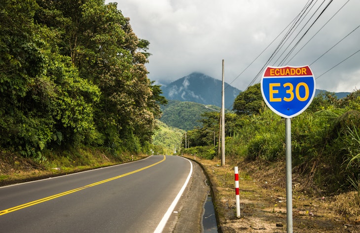 Road sign on an empty  jungle street in Ecuador on the way from Banos to Puyo which is popular tourist bicycle trail. Blue and  red sign with road number  and country name in yellow.; Shutterstock ID 269034758; GL: 65050; netsuite: Online editorial; full: Ecuador road trips ; name: Claire Naylor
269034758
Road sign on an empty  jungle street in Ecuador on the way from Banos to Puyo which is popular tourist bicycle trail. Blue and  red sign with road number  and country name in yellow.