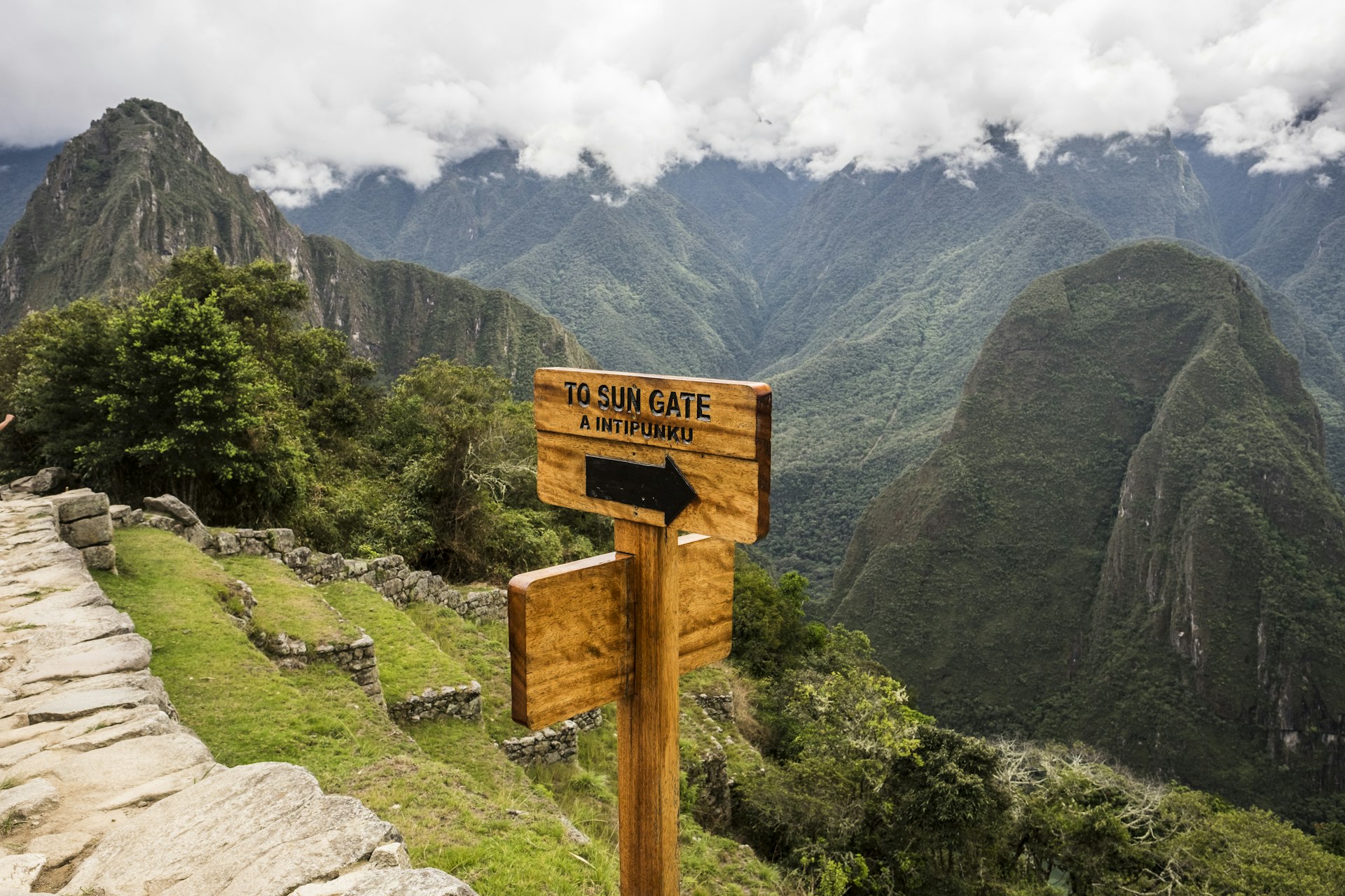 Sign showing the way to the Sun Gate, about a mile along a trail from the Machu Picchu site. The Sun Gate was once the main entrance from the south. 