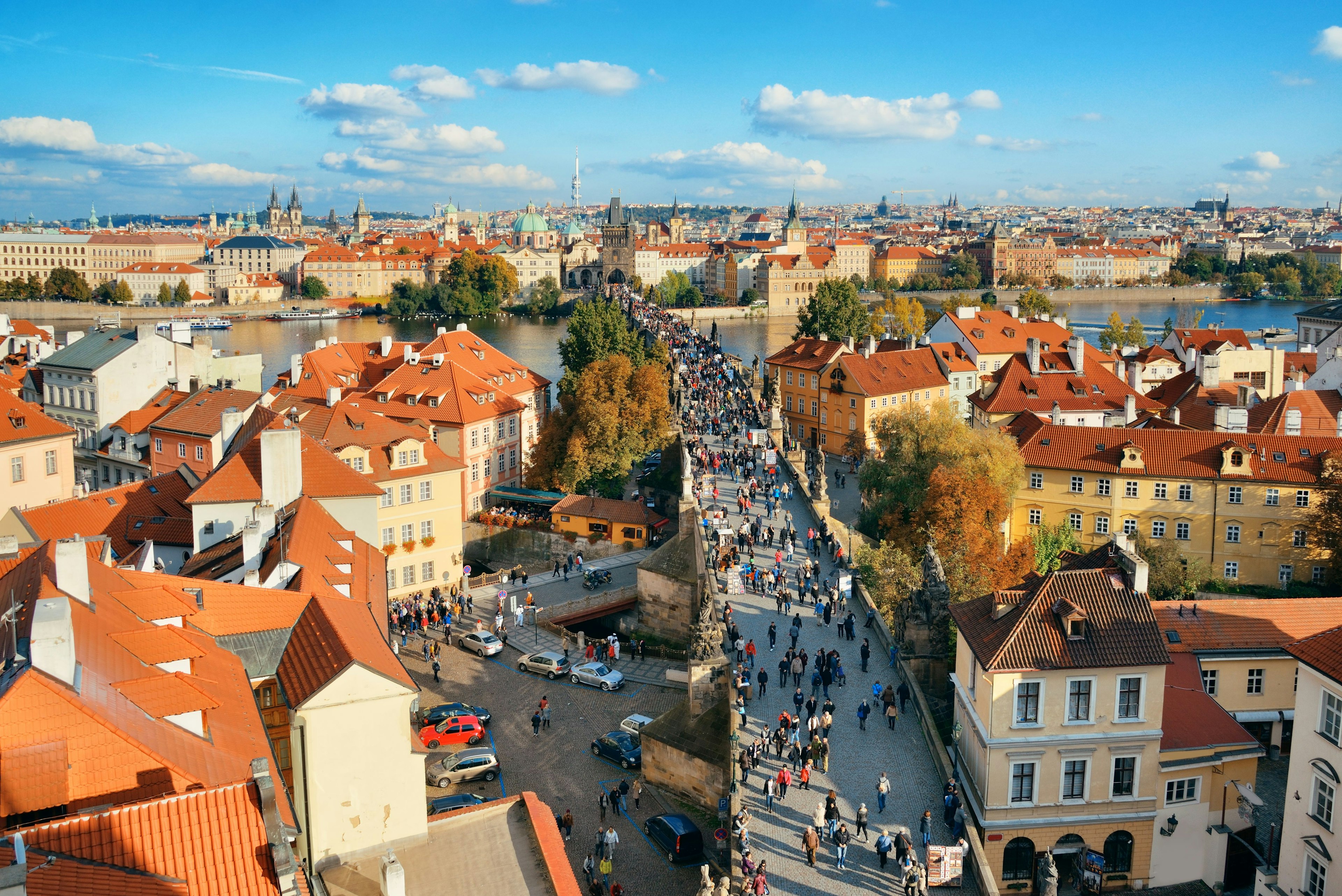 High-angle view of people crossing the Charles Bridge in Prague.