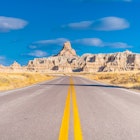 Empty Badlands Loop Road in Badlands National Park.
560780143
badlands, tree, destination, america, usa, dust, natural, sedimentary, soils, summit, rocks, earth, travel, wonder, lands, rocky, mountains, horizontal, sign, sand, south, butte, drought, geo, scenery, formation, sandstone, pinnacle, place, famous, erosion, clay, fossil, desert, peak, nature, eroded, spires, geology, dry, road, landscape, dakota, pavement, lakota