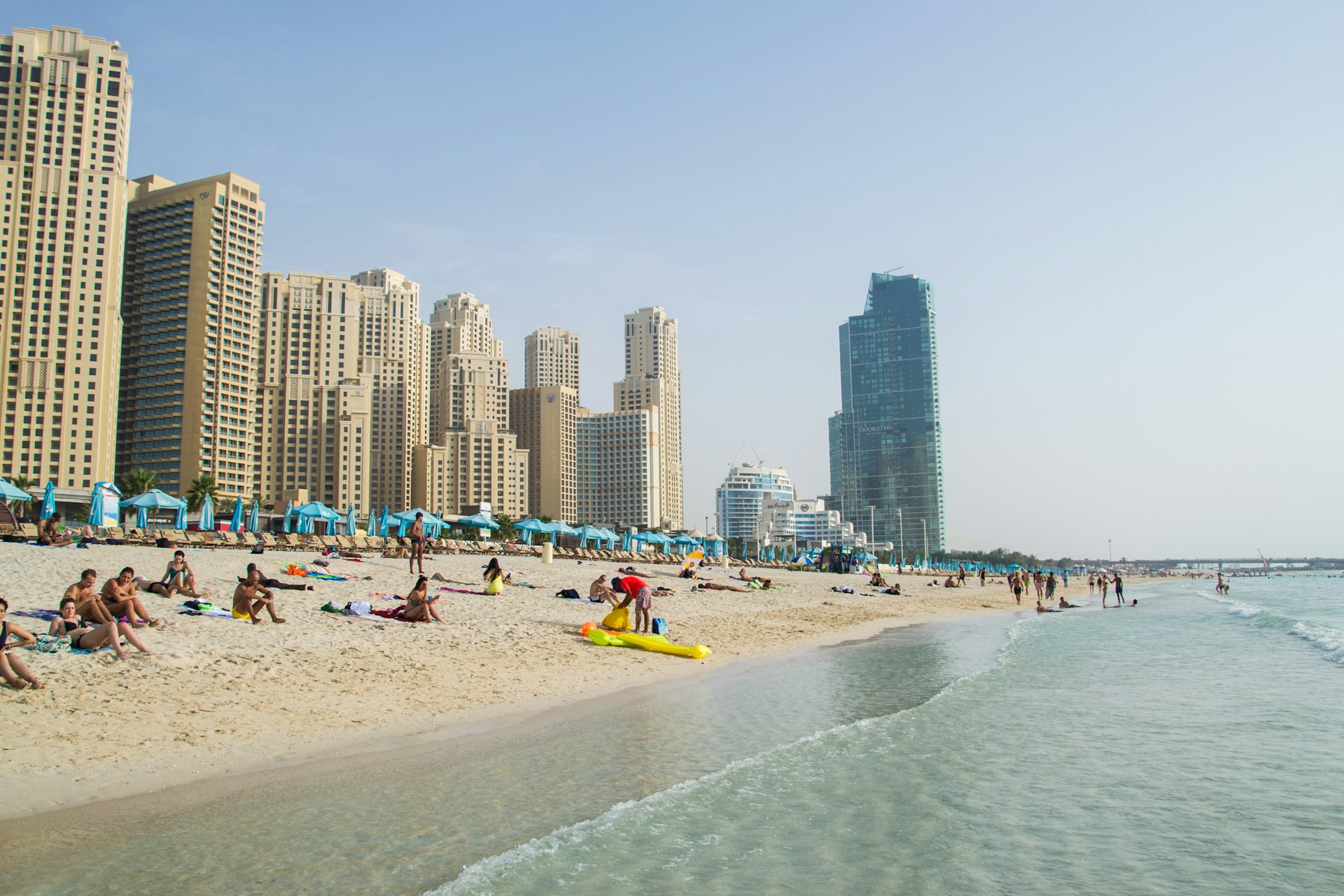 Dubai Marina and JBR beach with sunbathers