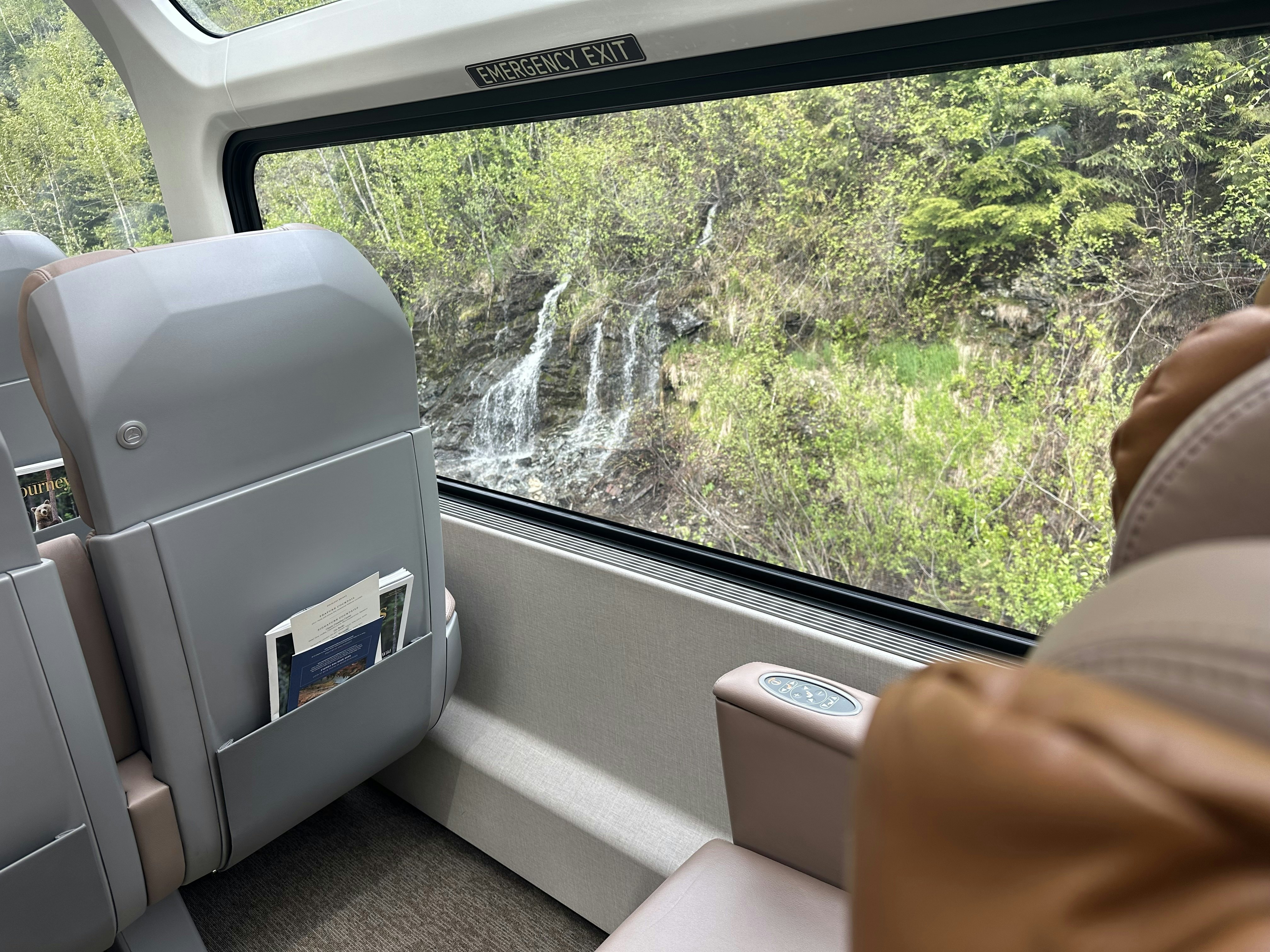 A waterfall at the side of the train tracks