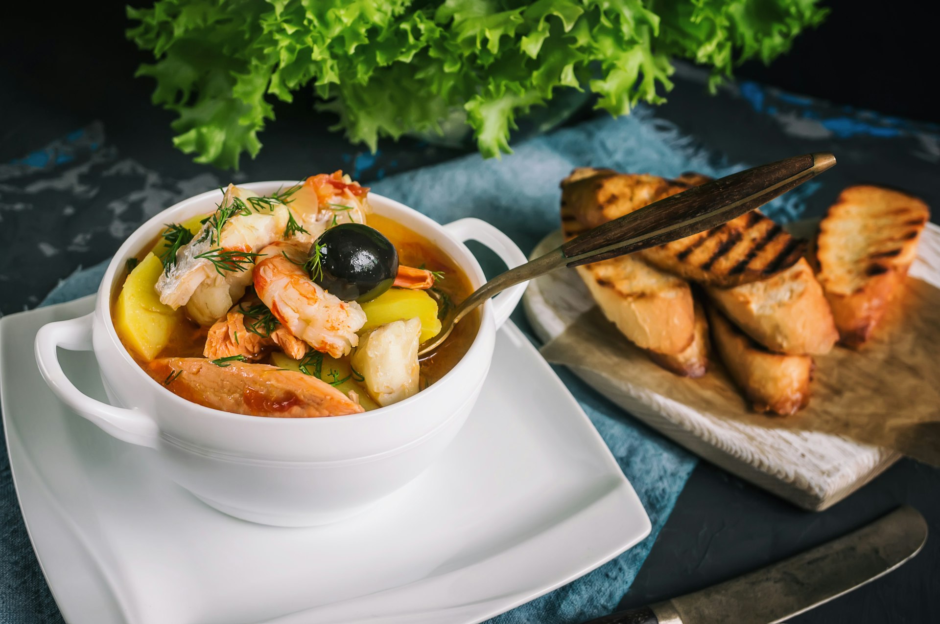 French fish soup Bouillabaisse with salmon fillet and shrimp.