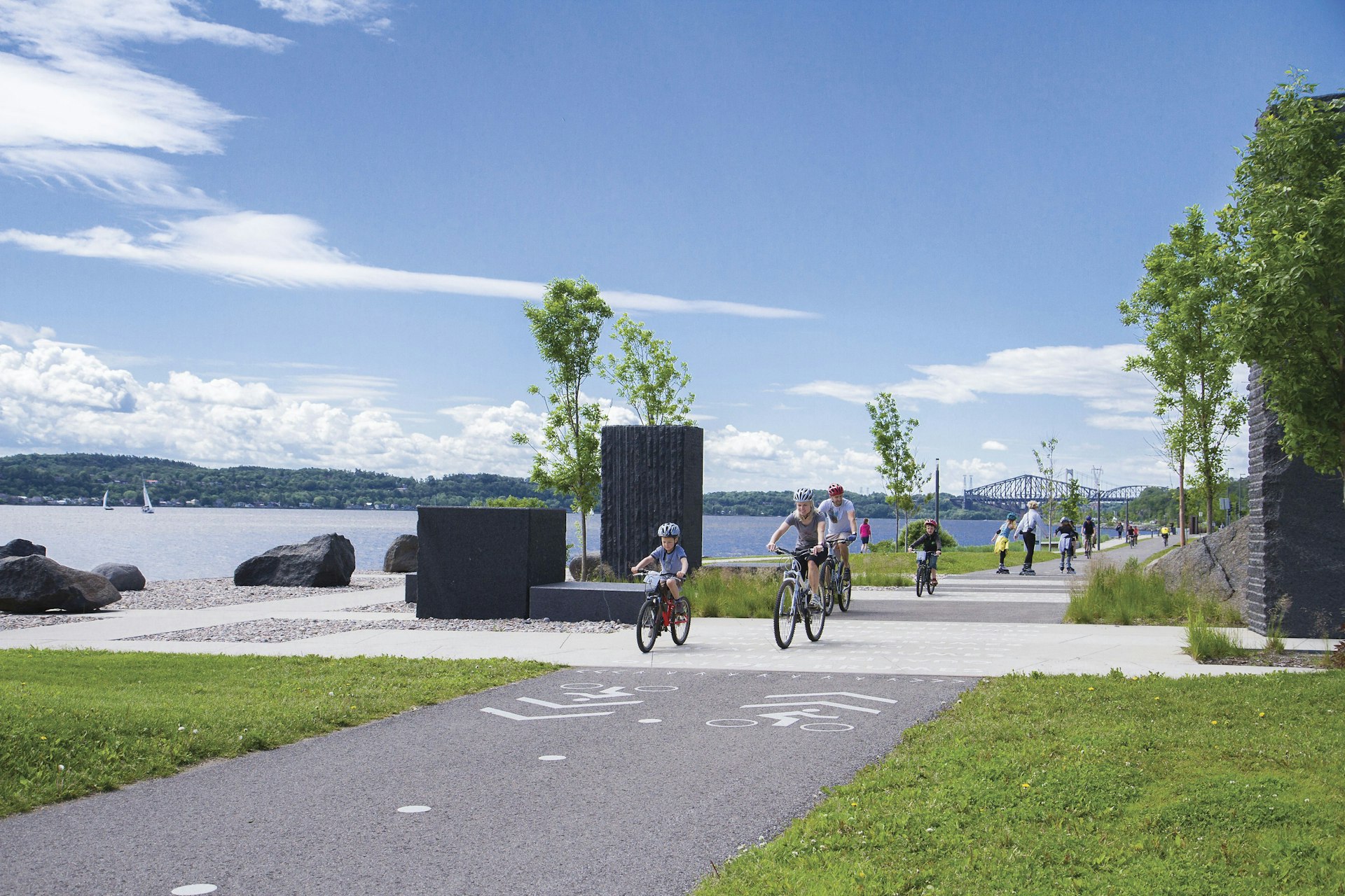 Cyclists on a bike path by the St-Lawrence River in Québec City, Québec, Canada