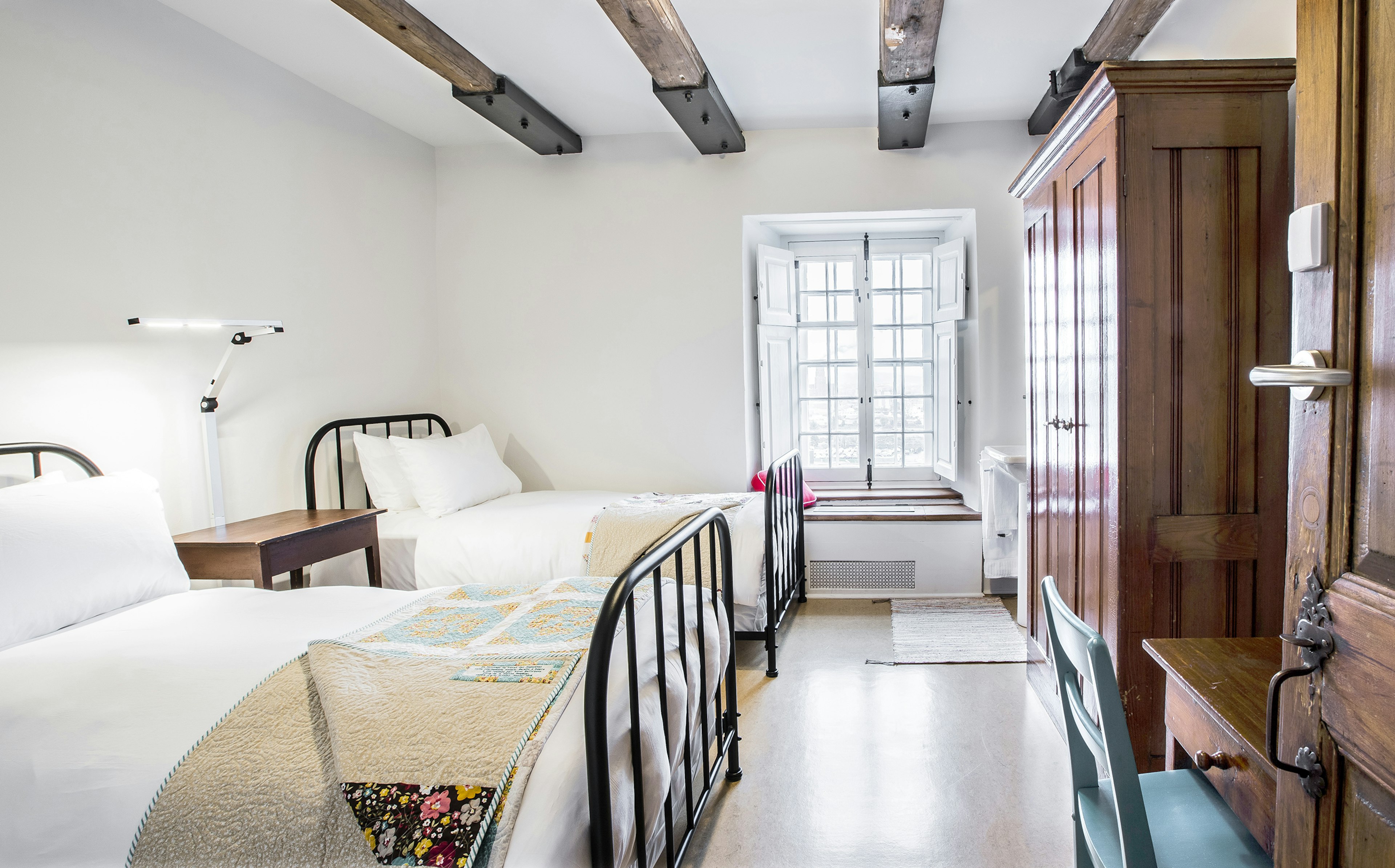 "Authentic" room at Monastère des Augustines, a former convent converted into a hotel and wellness center