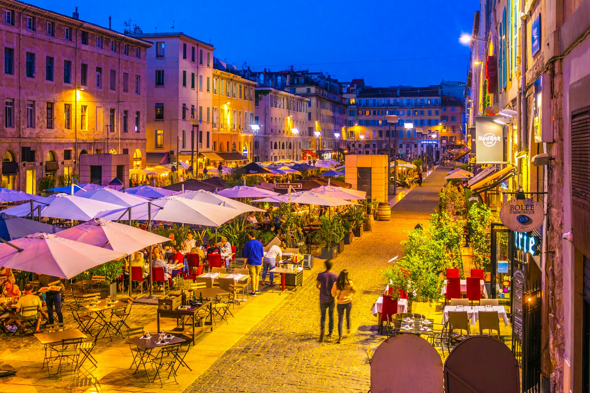 Night view of a square full of restaurants at port vieux part of Marseille, France