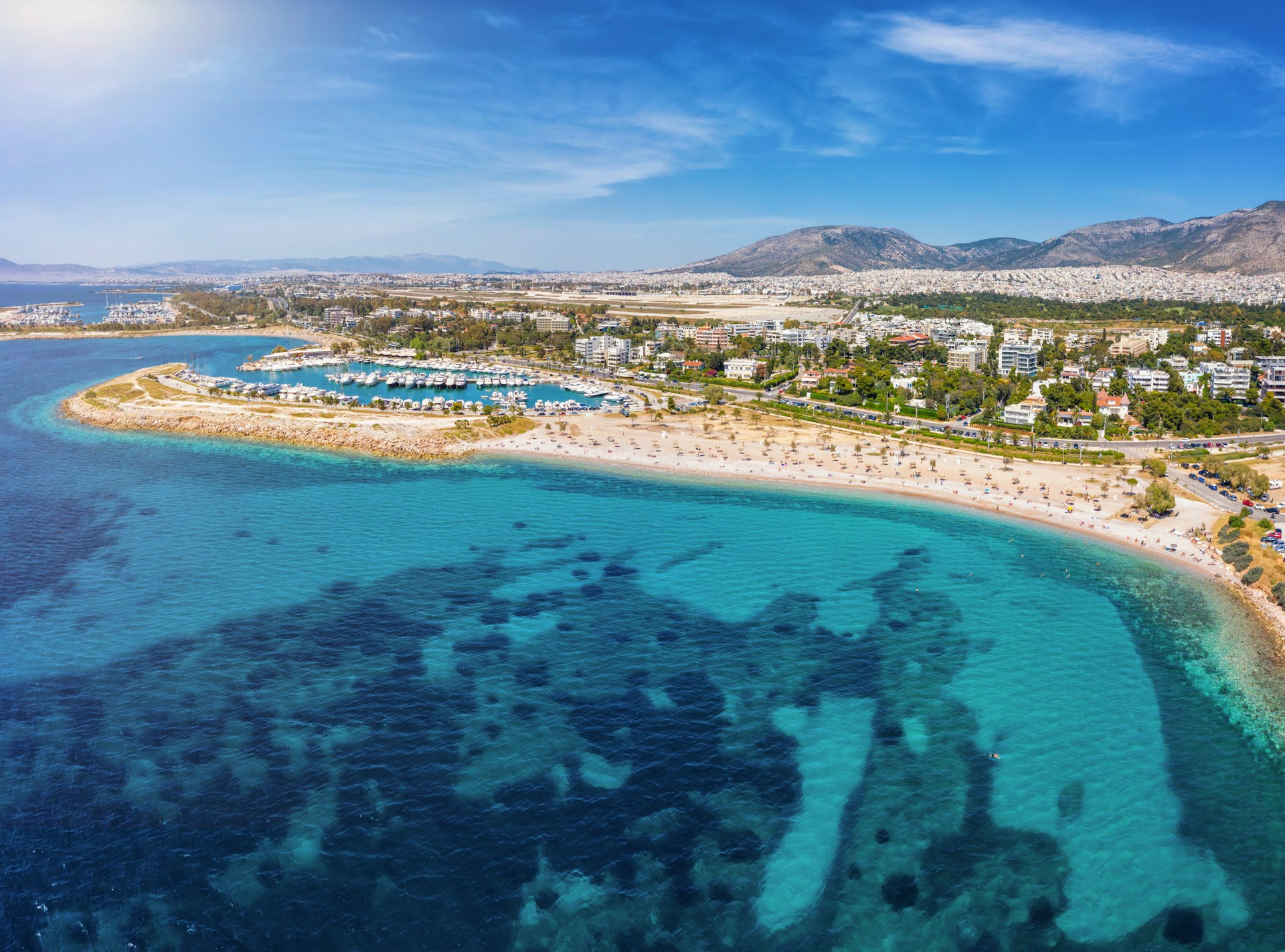 Aerial view to the beach of Glyfada, part of the south Athens riviera with yacht marinas and turquoise sea, Greece