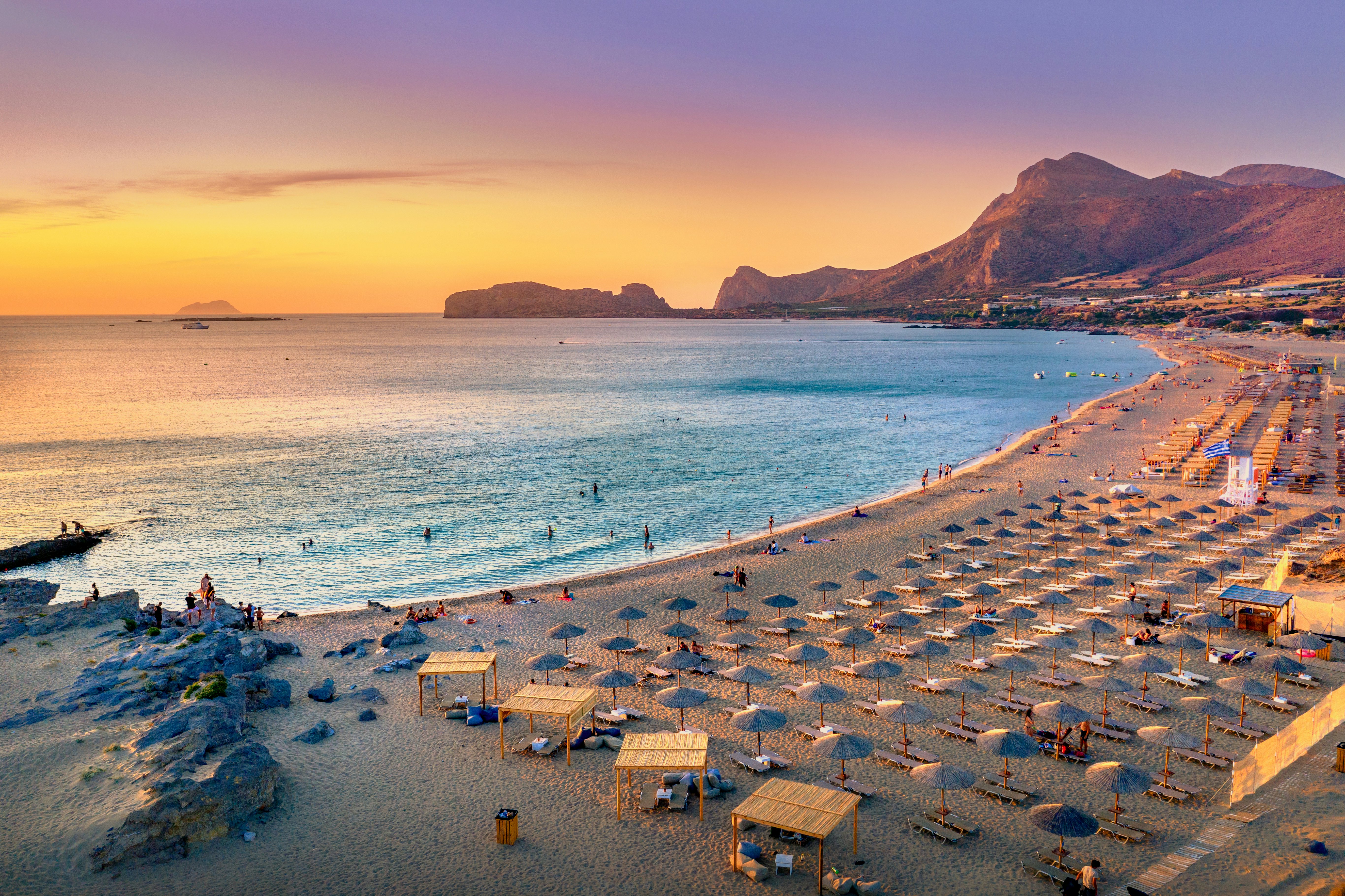 Falassarna beach at sunset with peach and creamy skies