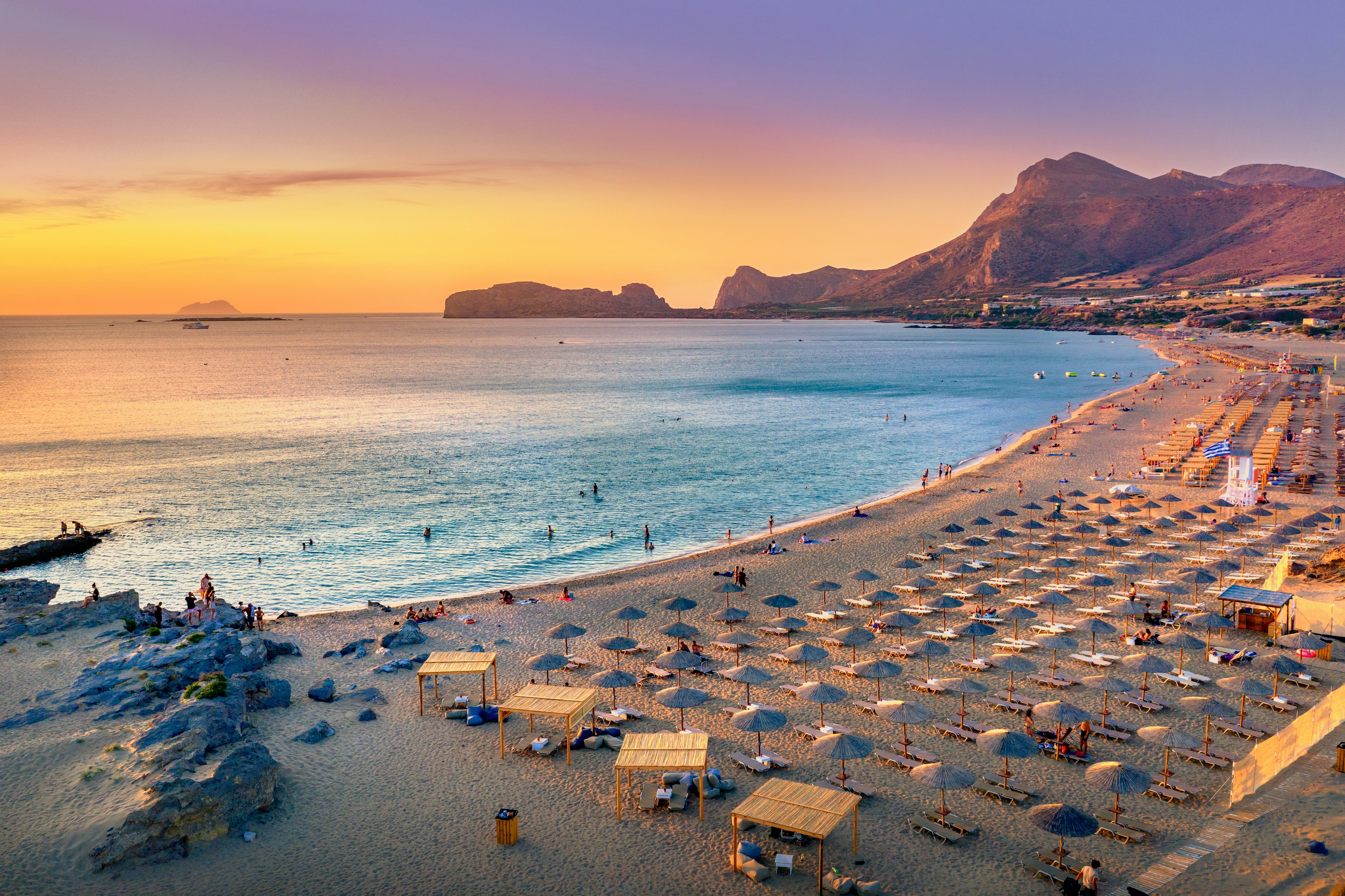 Falassarna beach at sunset with peach and creamy skies