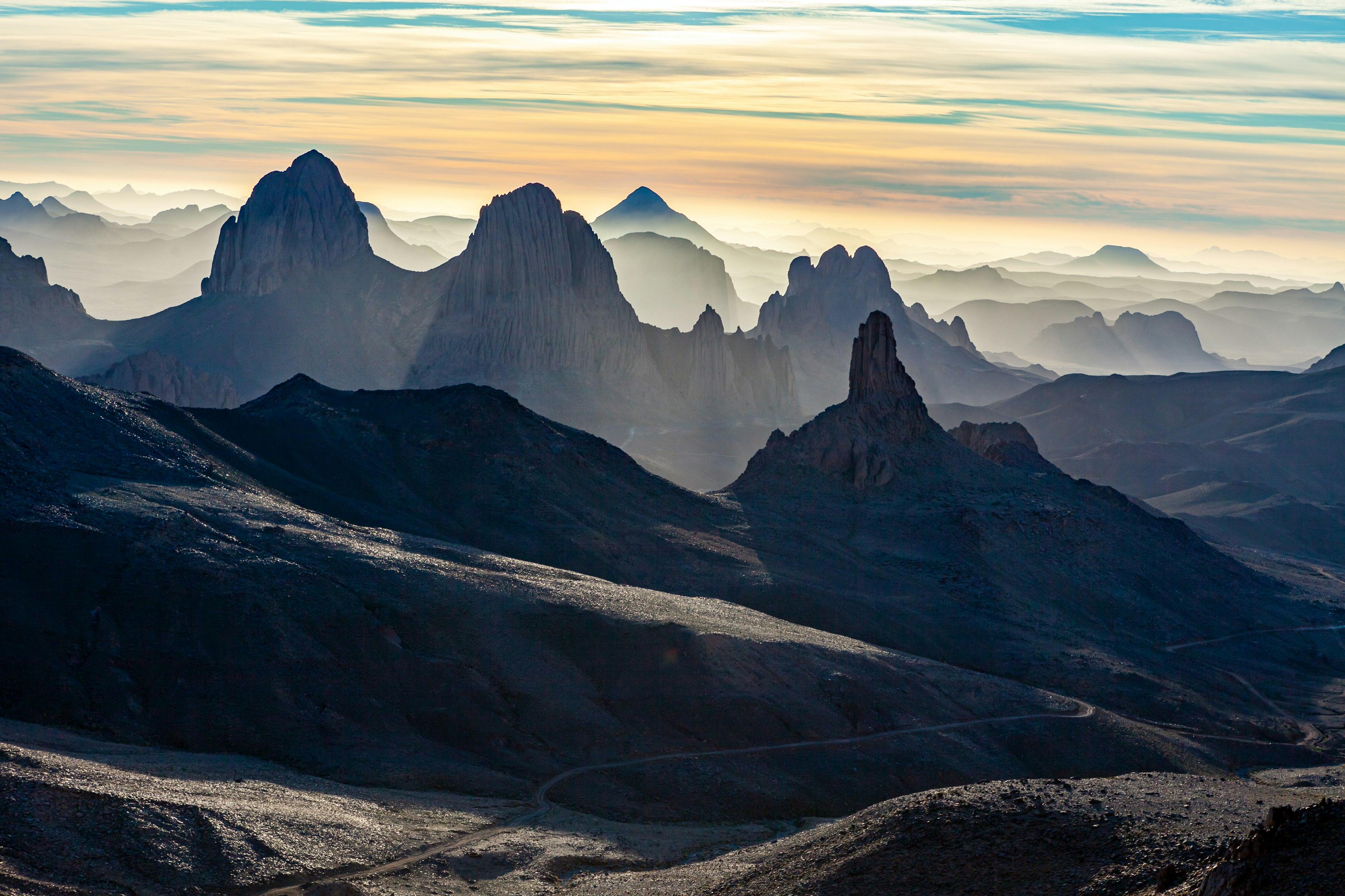 Basalt rock formations at sunrise in the Ahaggar Mountains, Ahaggar National Park, Algeria