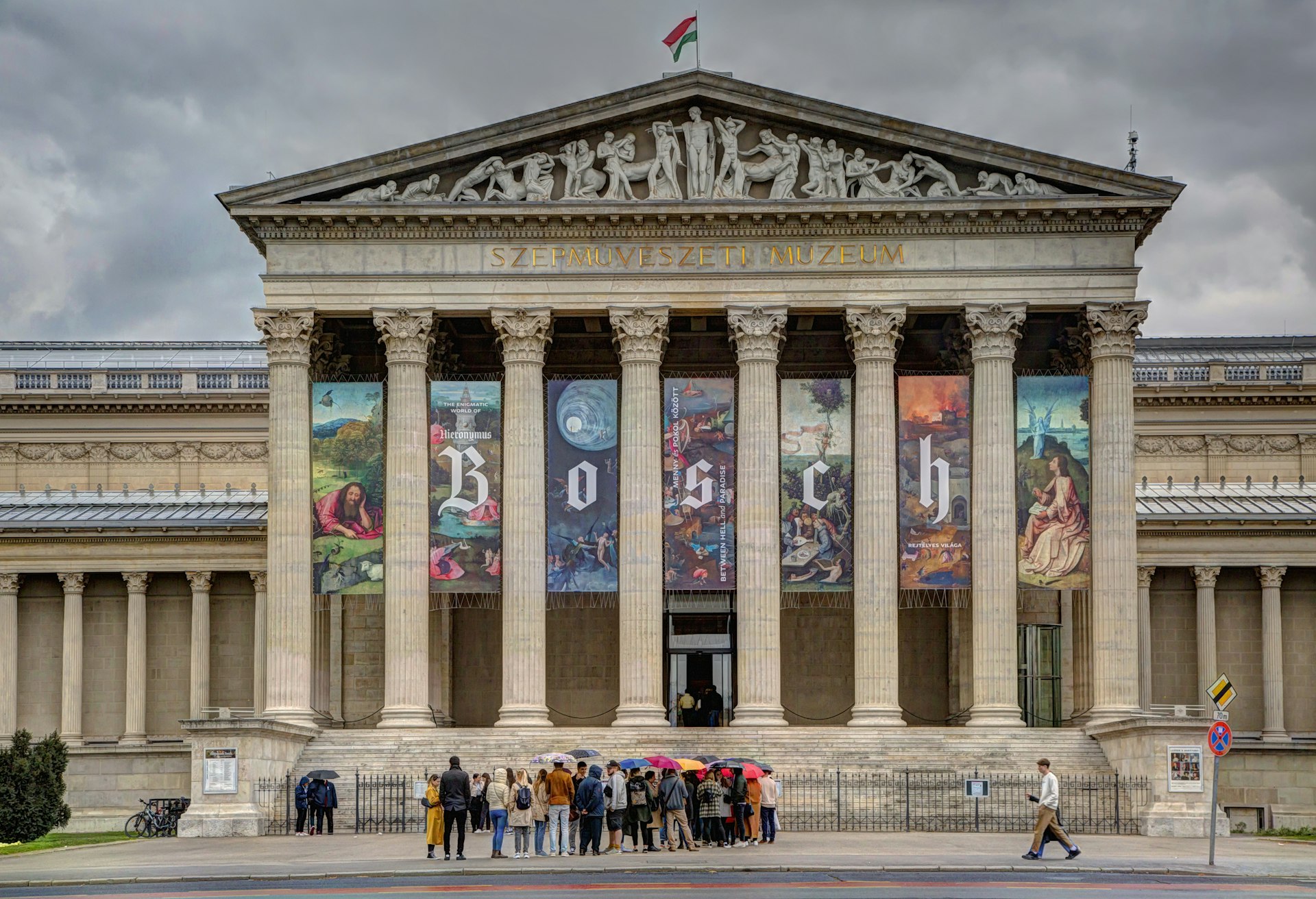 A crowd of people waiting outside of the Museum of Fine Arts in Budapest, Hungary